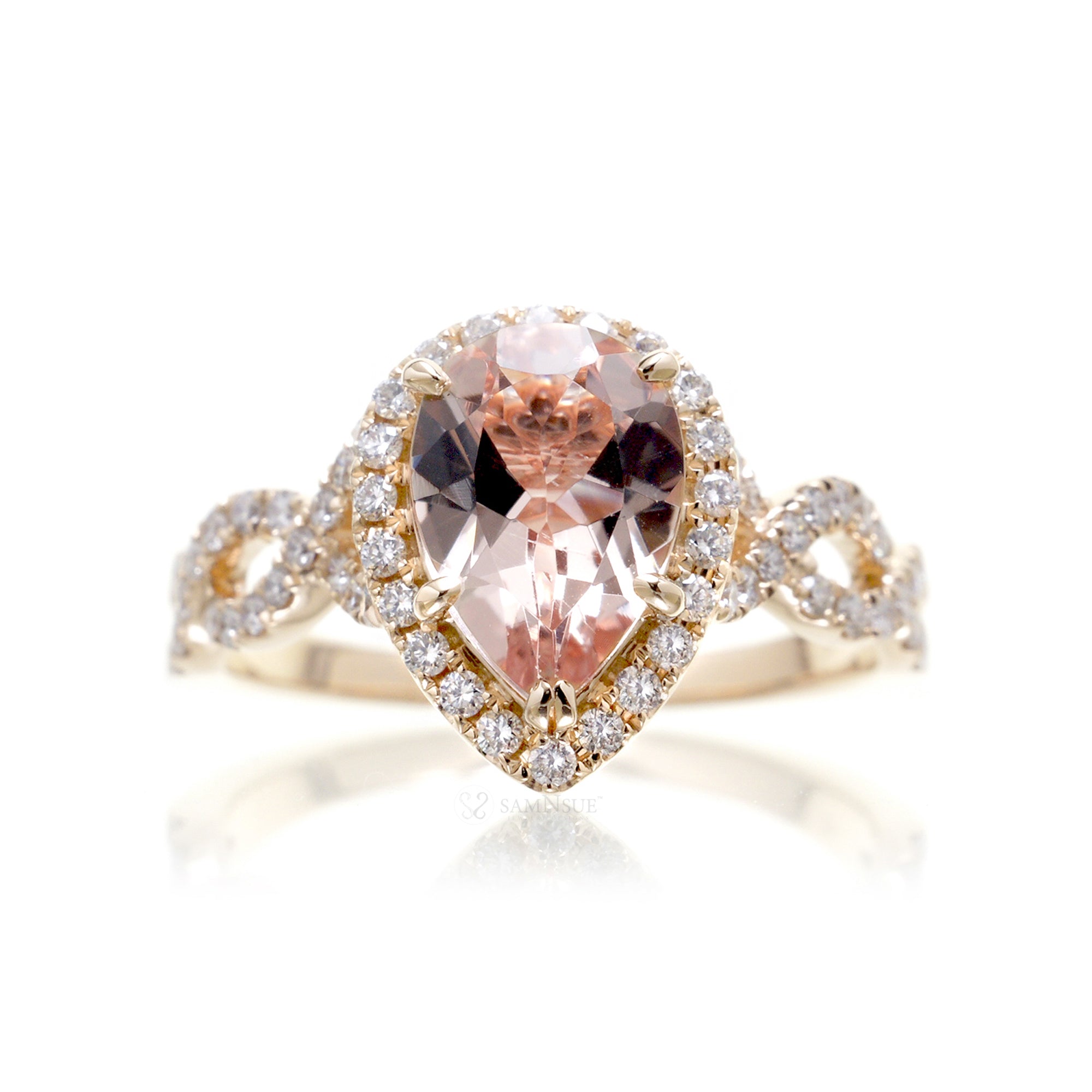 Pear morganite engagement ring yellow gold diamond halo twist band