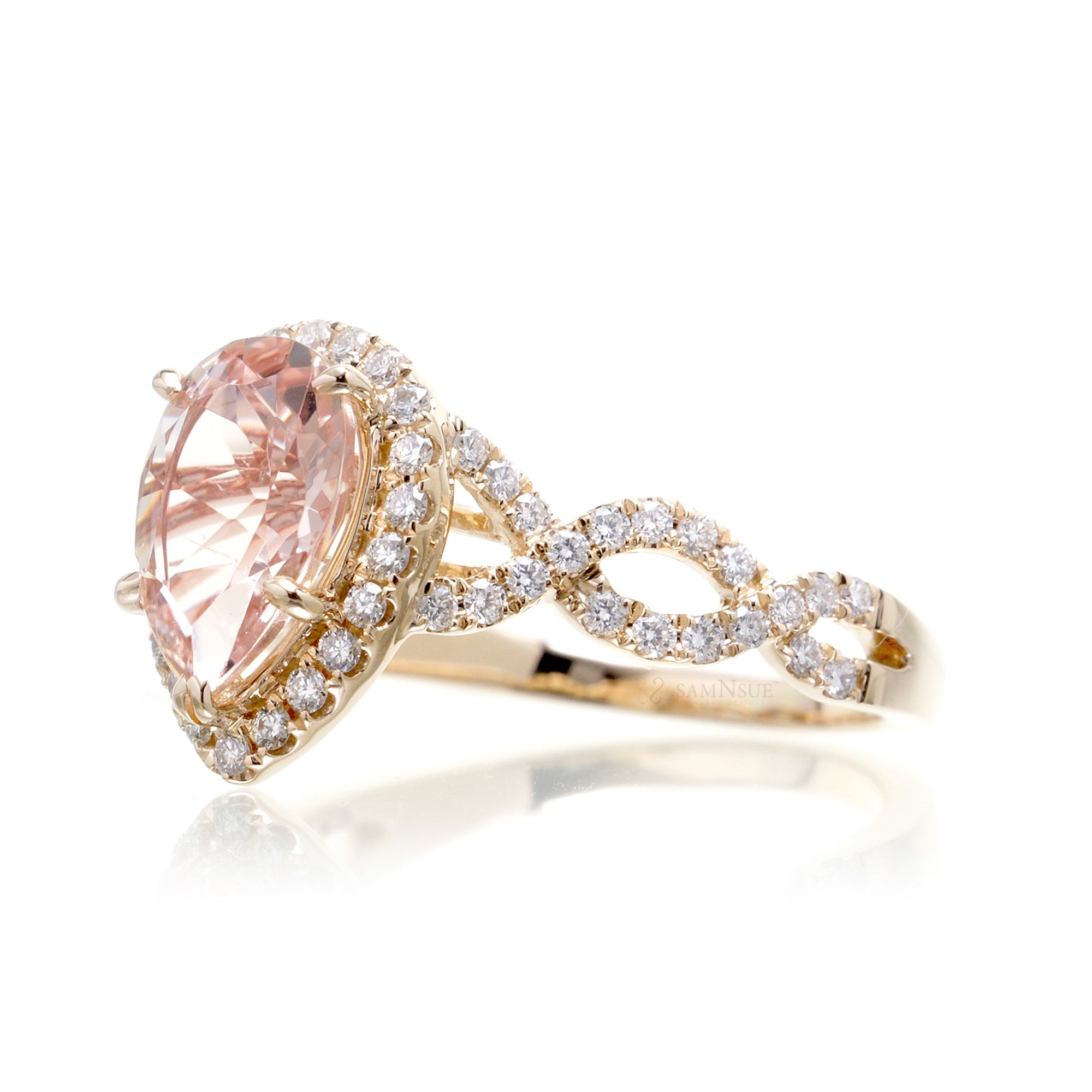 Pear morganite engagement ring yellow gold diamond halo twist band