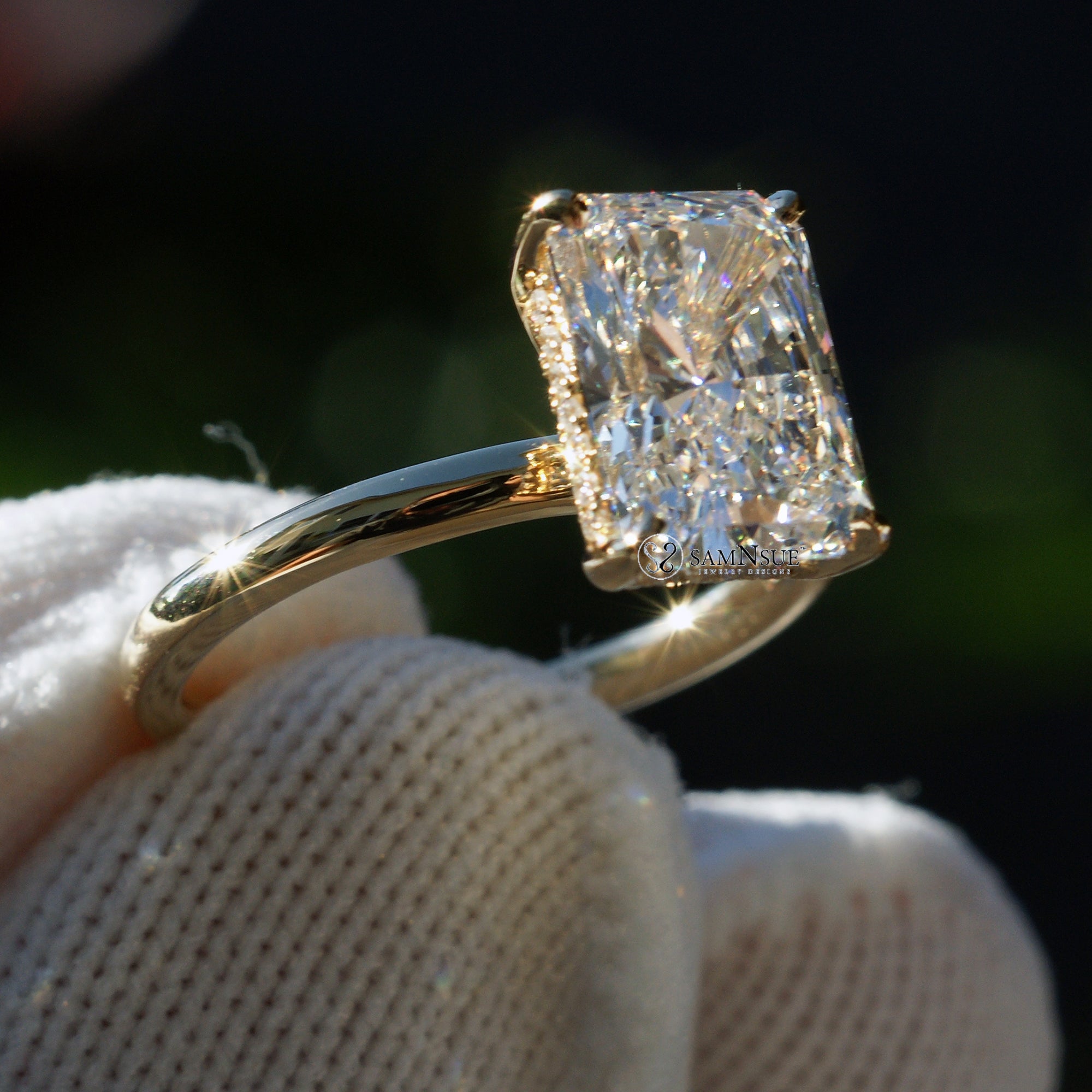 Radiant cut solitaire engagement ring in yellow gold with a hidden halo comfort fit band