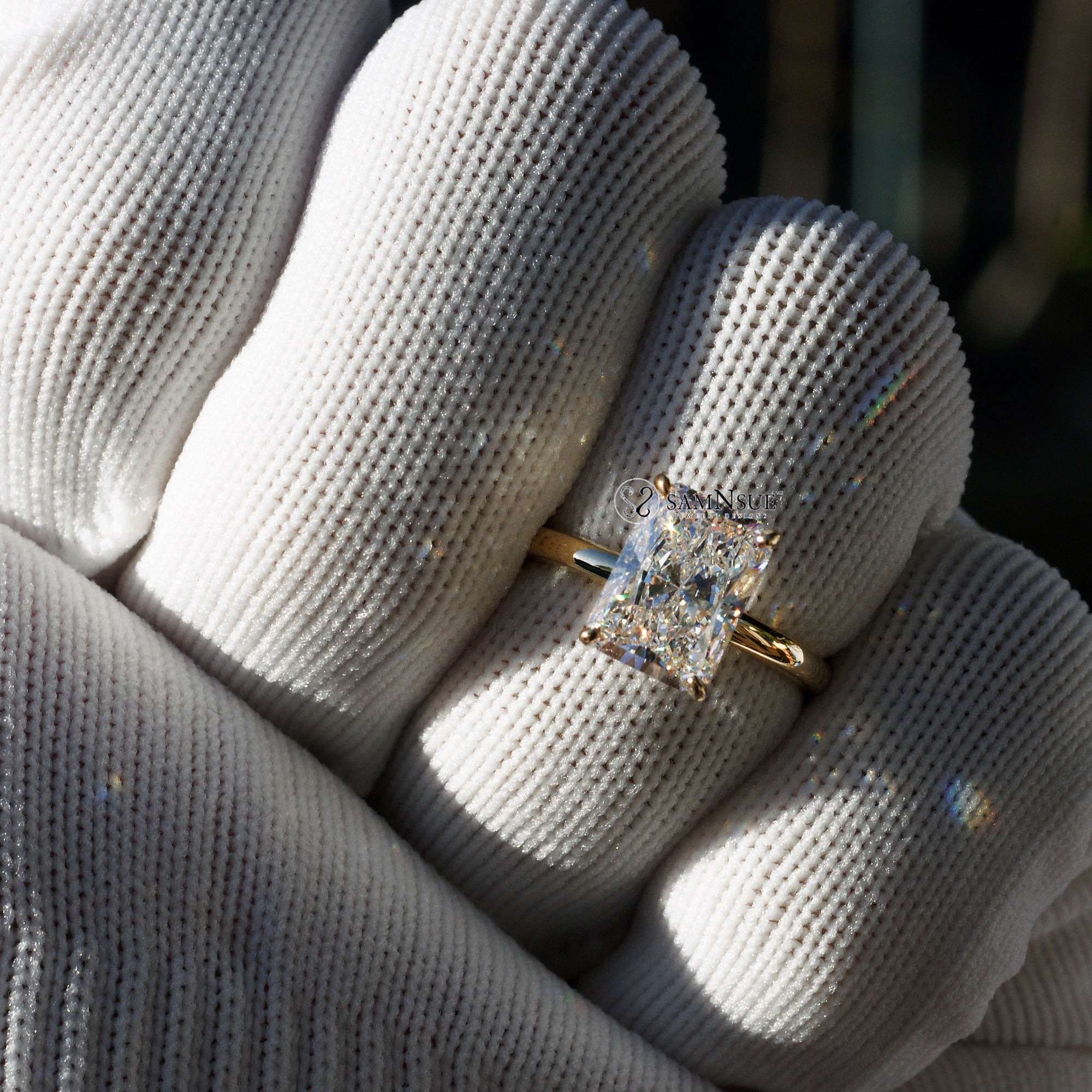 Radiant cut solitaire engagement ring in yellow gold with a hidden halo comfort fit band