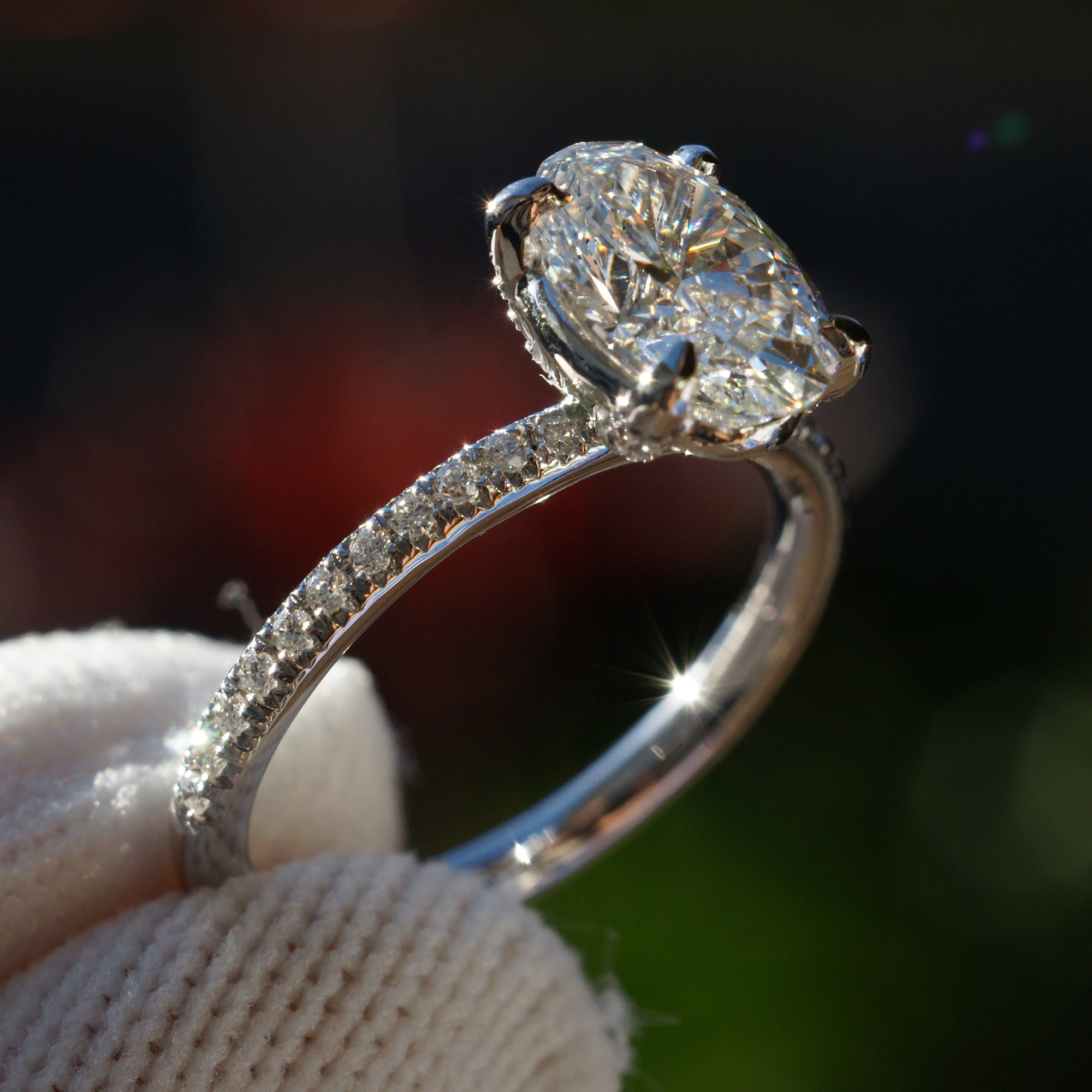 Oval diamond engagement ring in platinum with 1.5 carat center stone and 1.8mm diamond band