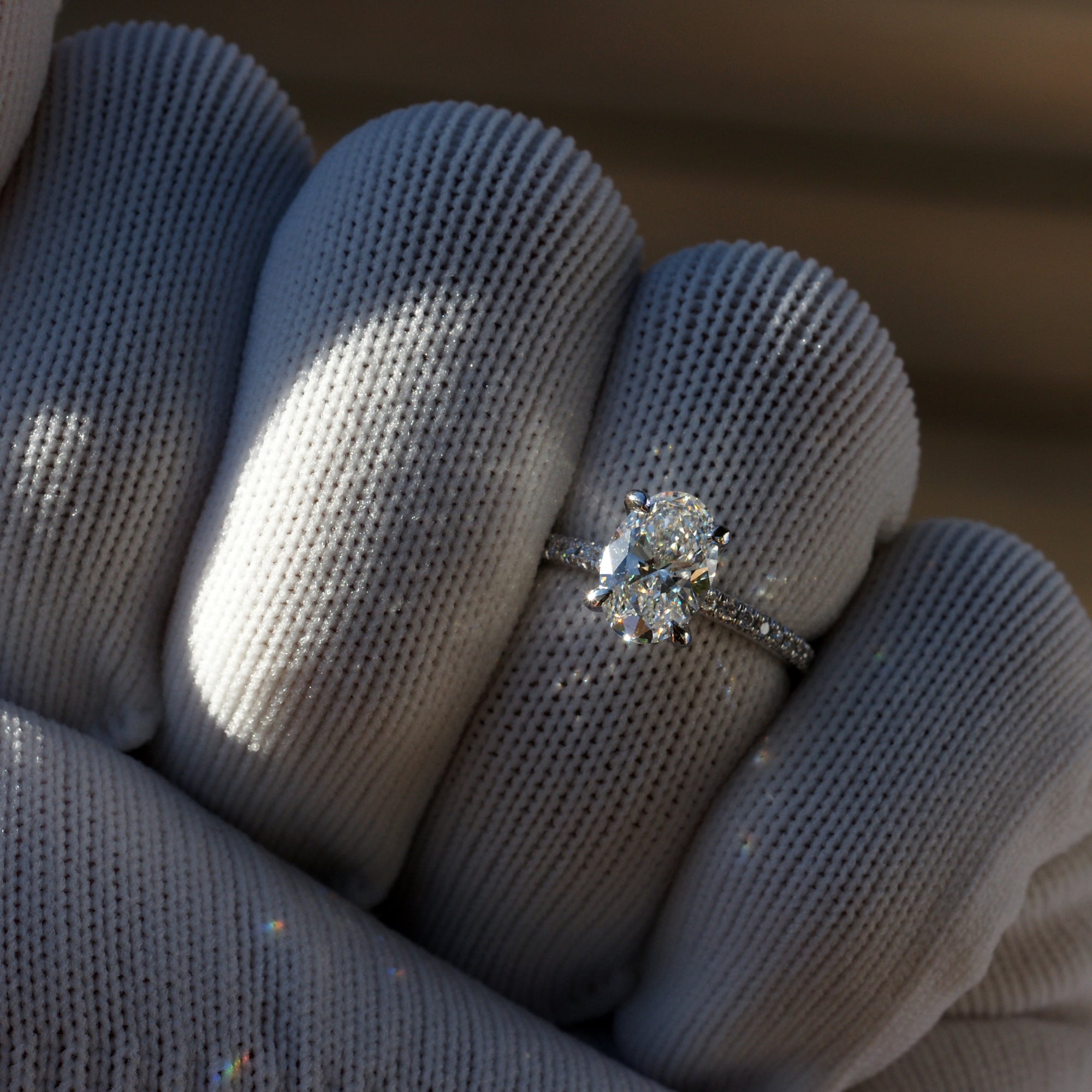 Oval diamond engagement ring in platinum with 1.5 carat center stone and 1.8mm diamond band