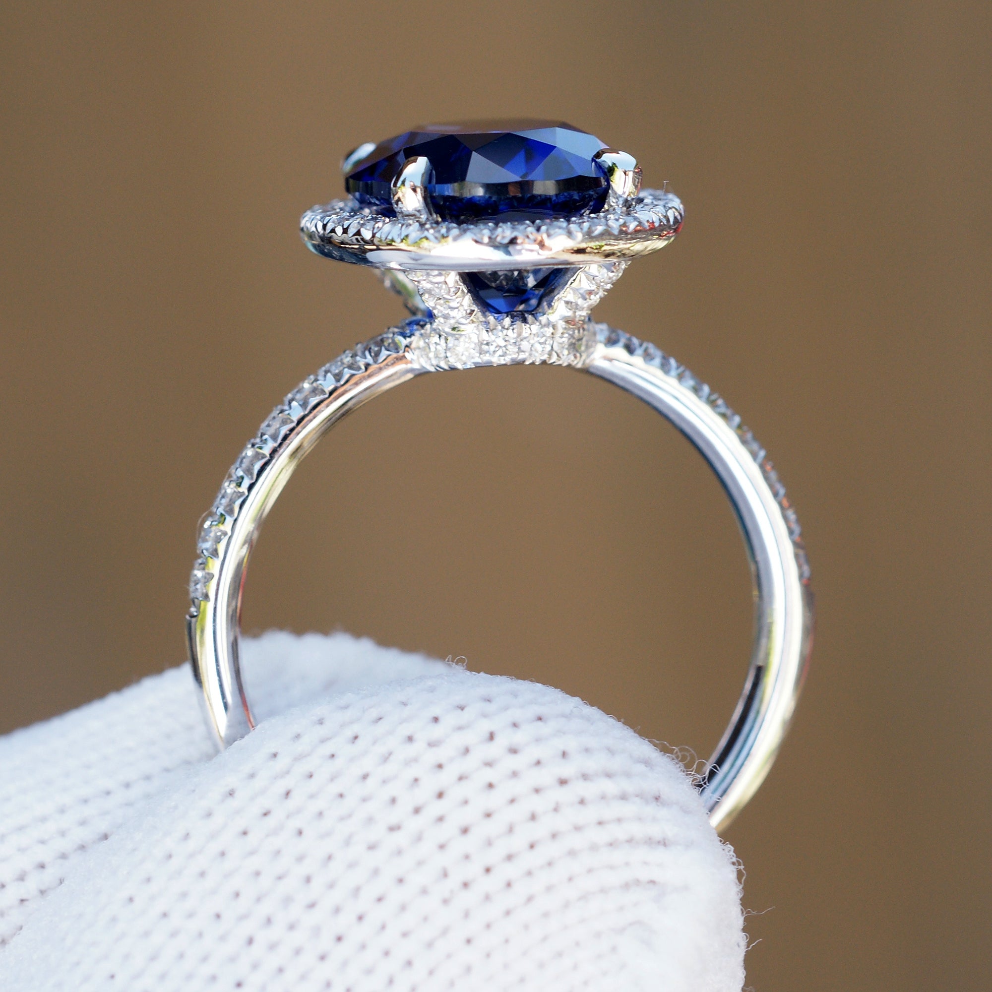 Oval Blue Sapphire Statement Ring in Diamond Halo and Platinum