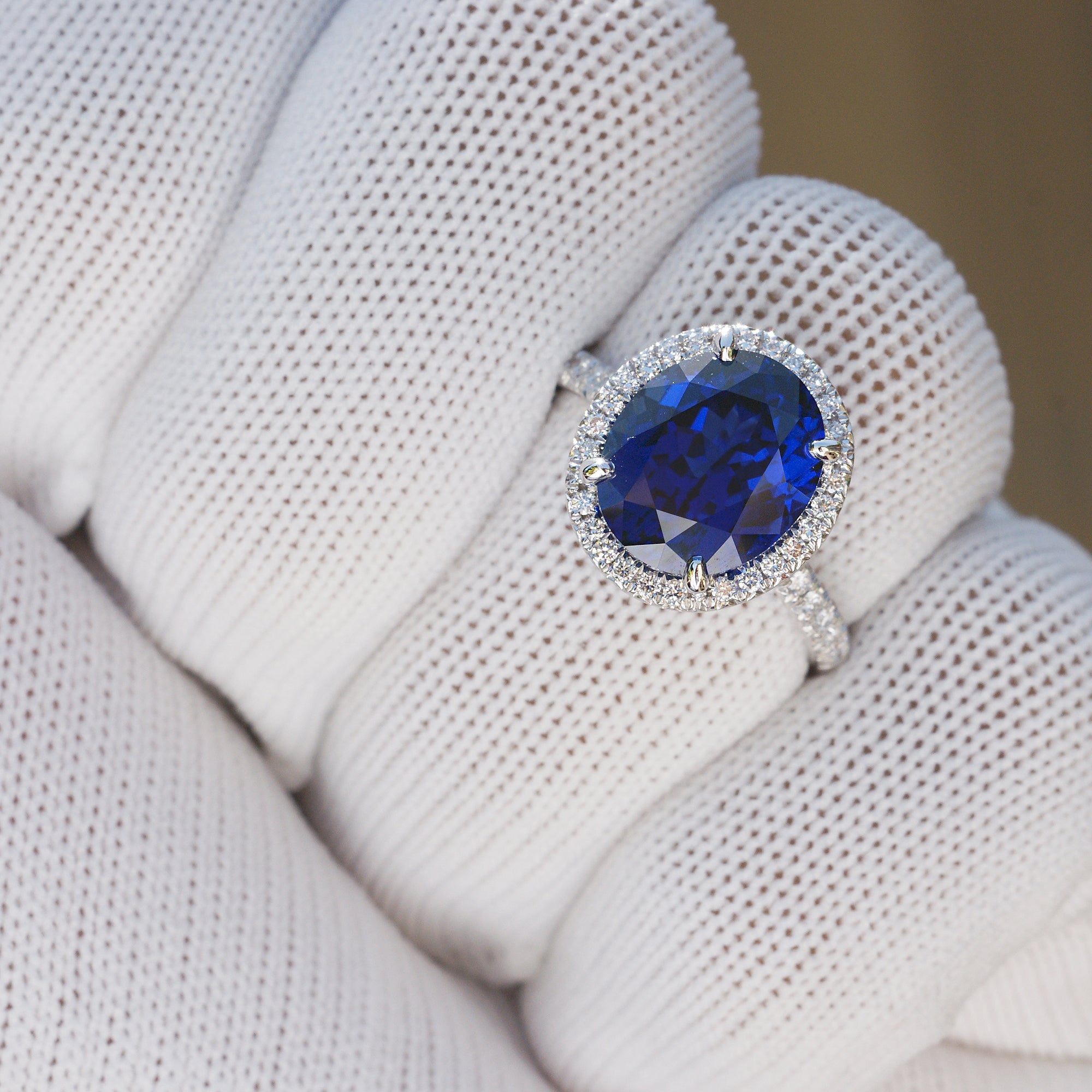 Oval Blue Sapphire Statement Ring in Diamond Halo and Platinum