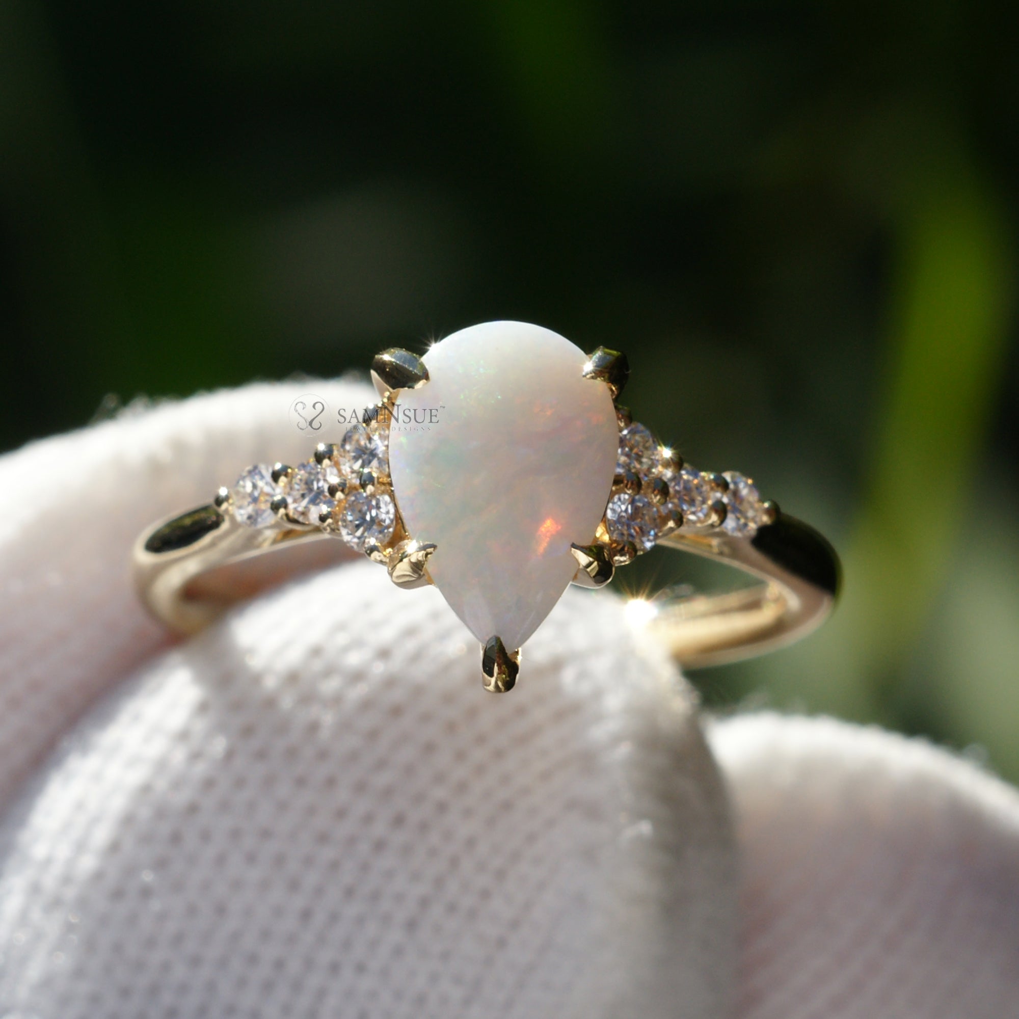 Fiery tear drop opal and diamond three stone ring yellow gold 9x6mm