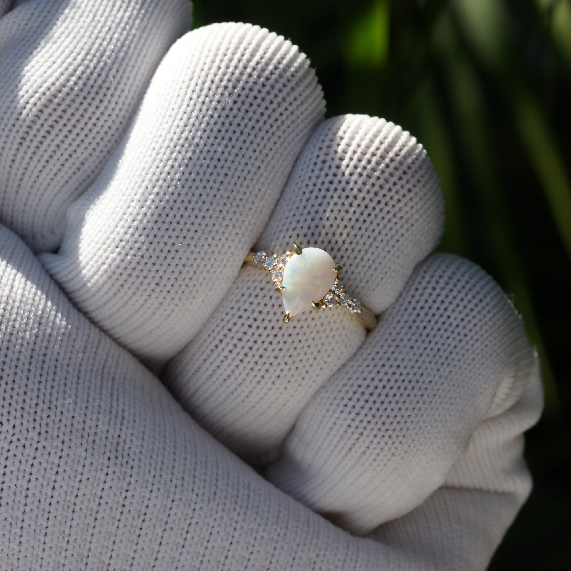 Fiery tear drop opal and diamond three stone ring yellow gold 9x6mm