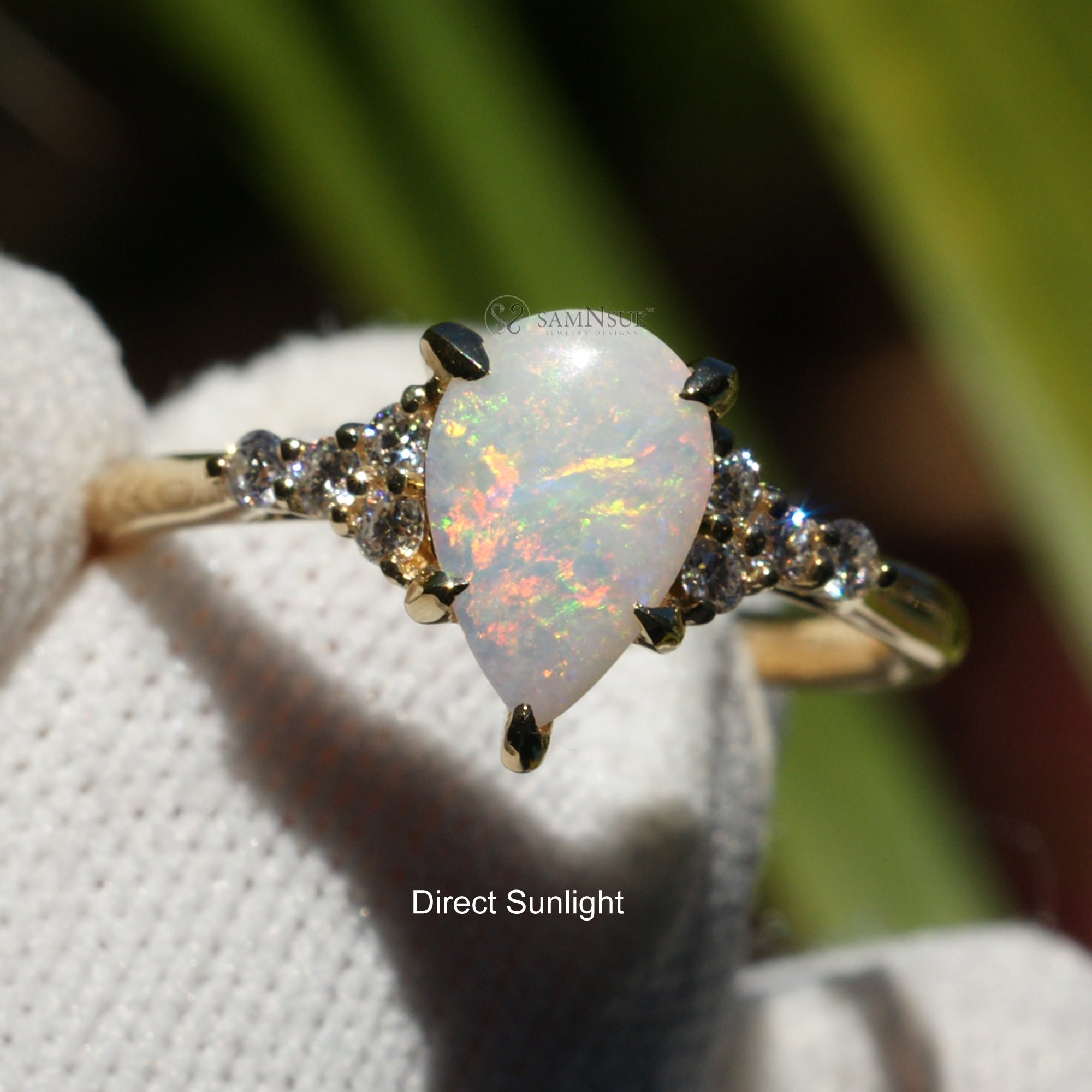 Fiery tear drop opal and diamond three stone ring yellow gold 9x6mm