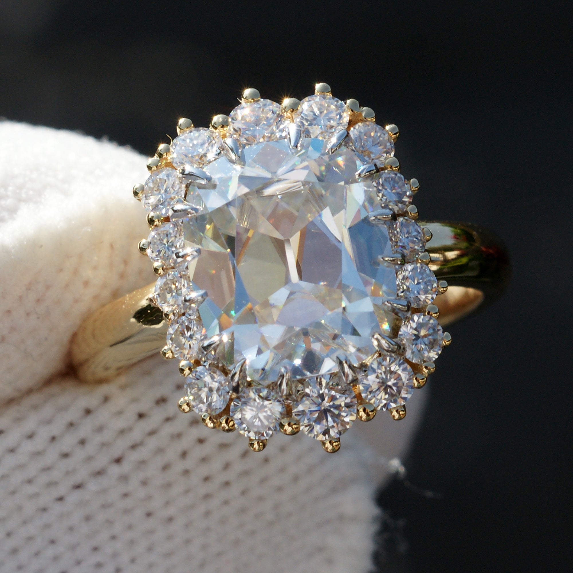Vintage style cushion moissanite diamond halo ring in yellow gold claw prongs