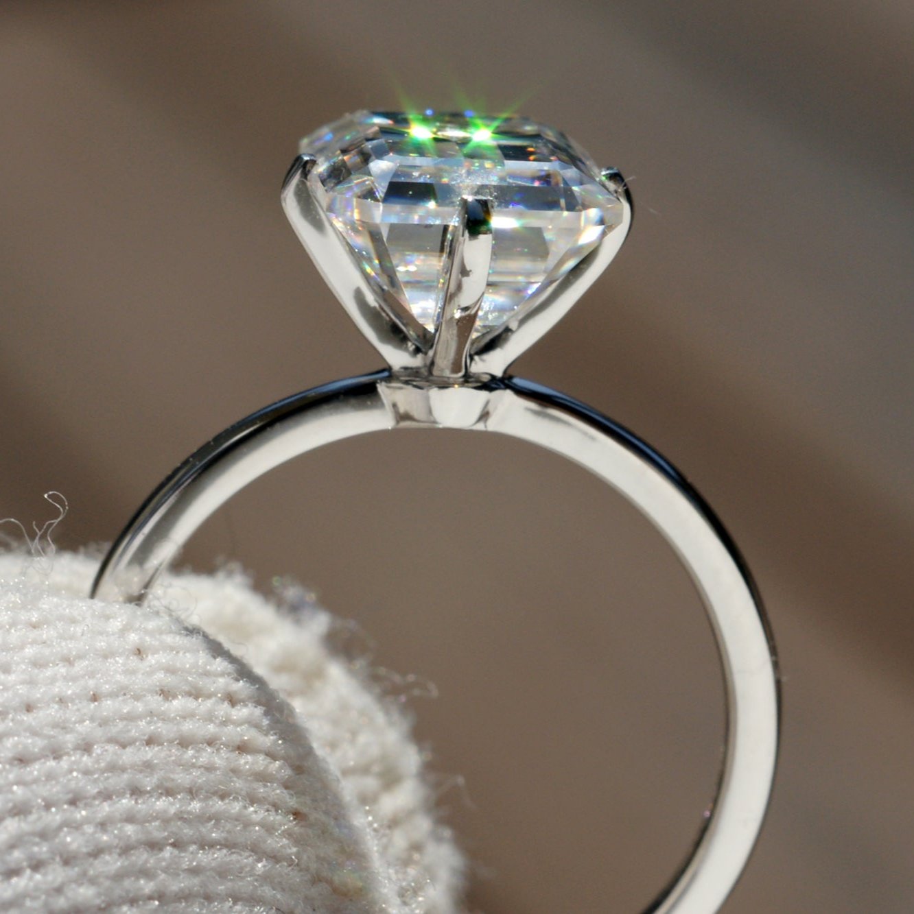 The Adeline Emerald Cut Moissanite 9x7mm 18k white gold
