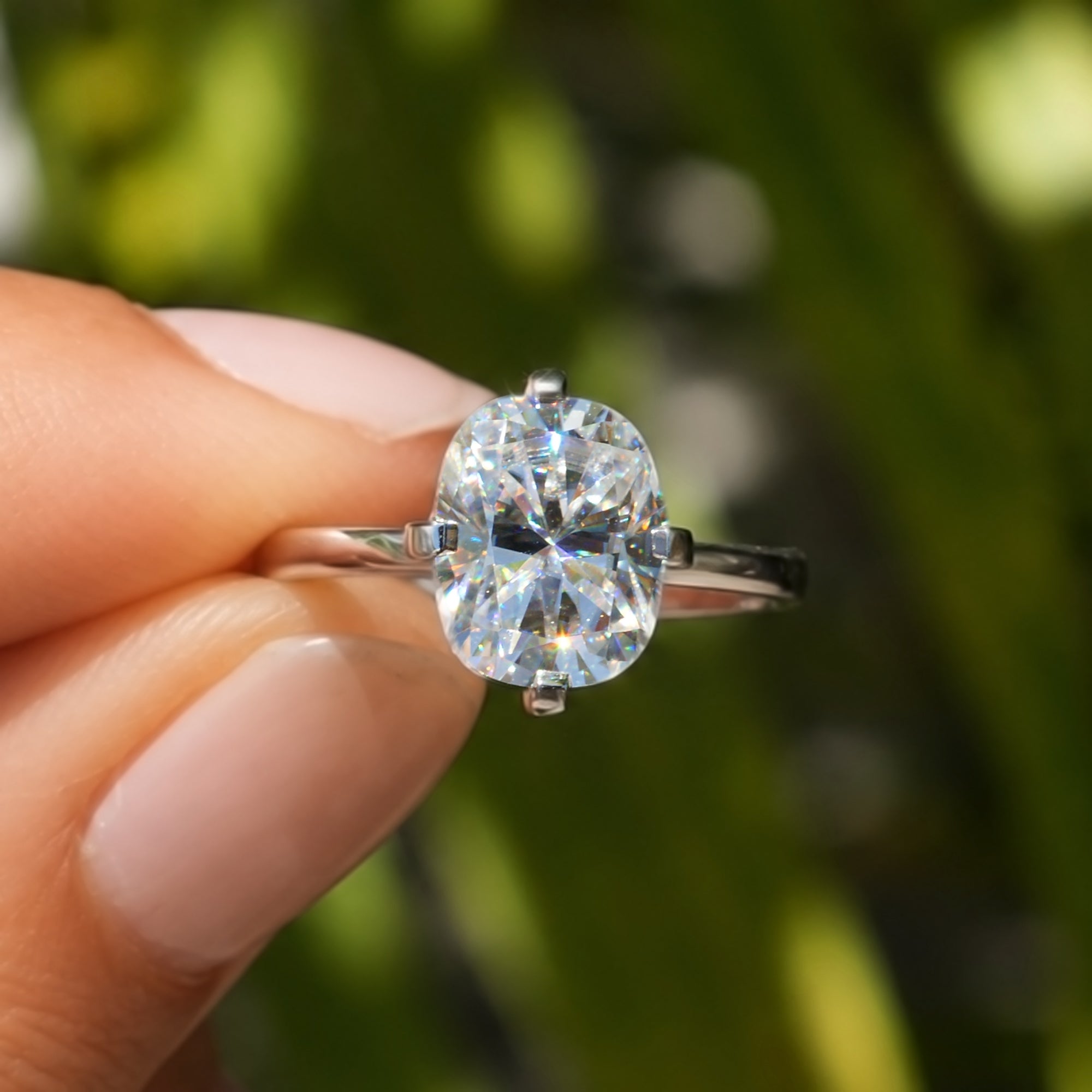 The Adeline Cushion Moissanite 10x8mm middle prongs