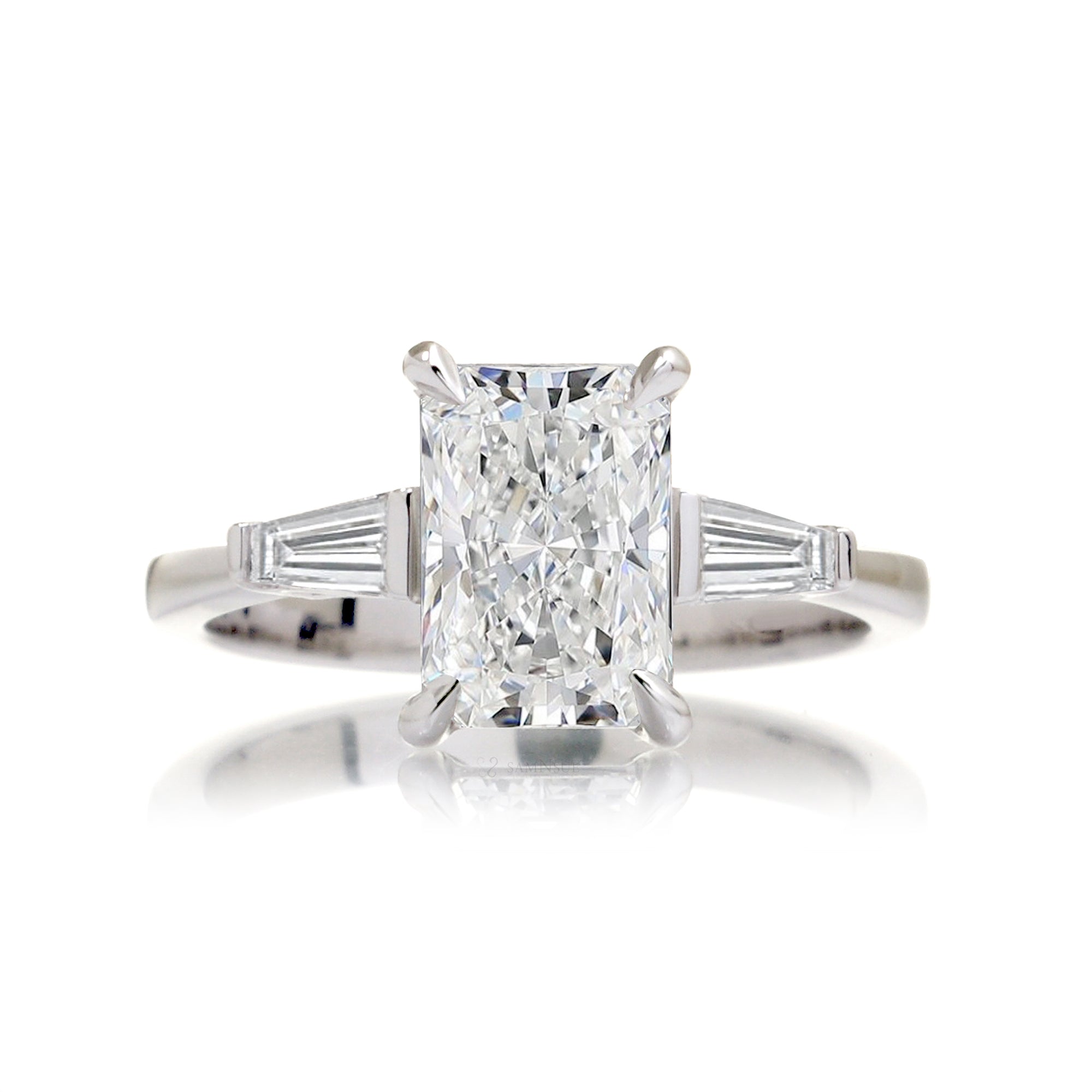 Radiant cut diamond three stone baguette ring