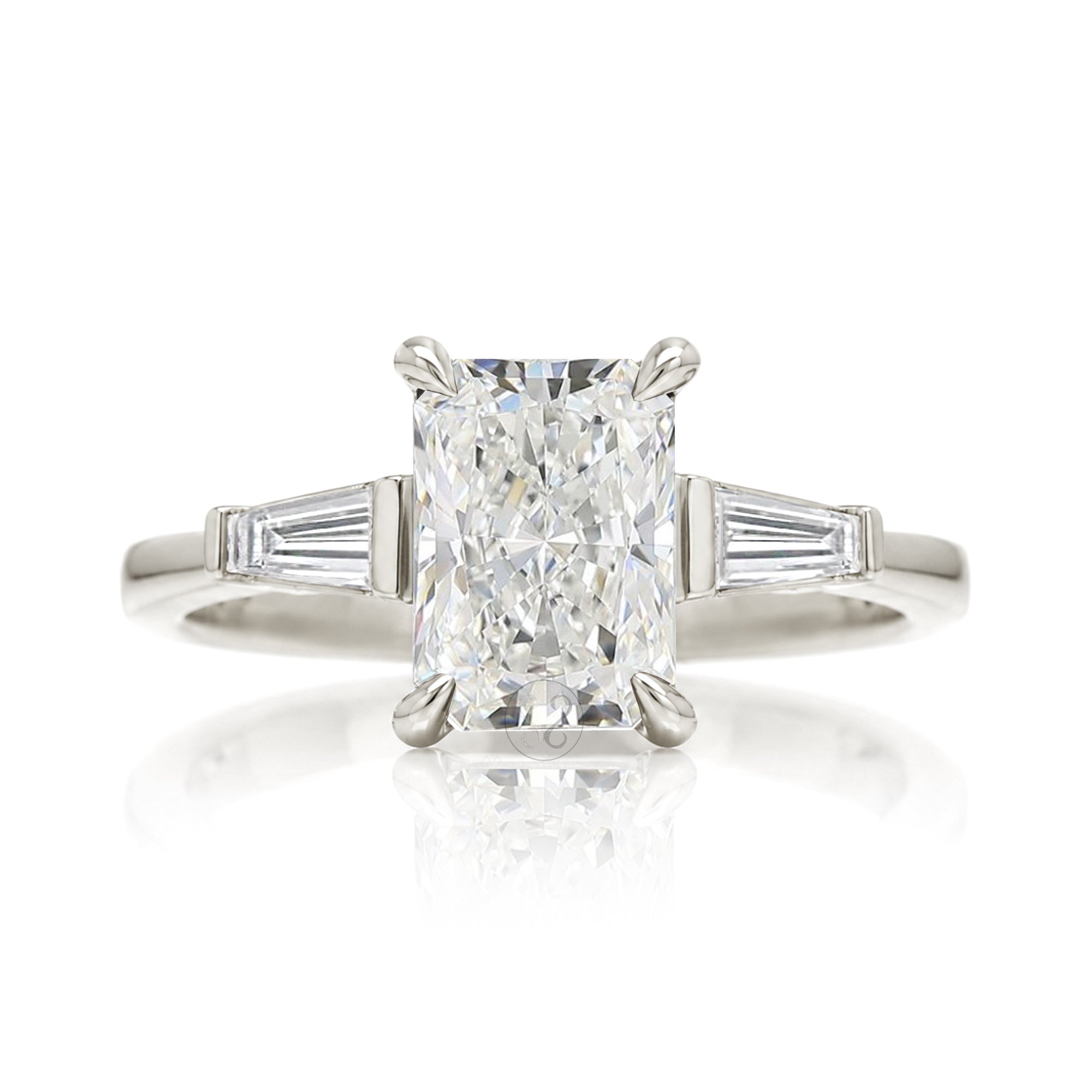 Radiant cut diamond three stone baguette ring