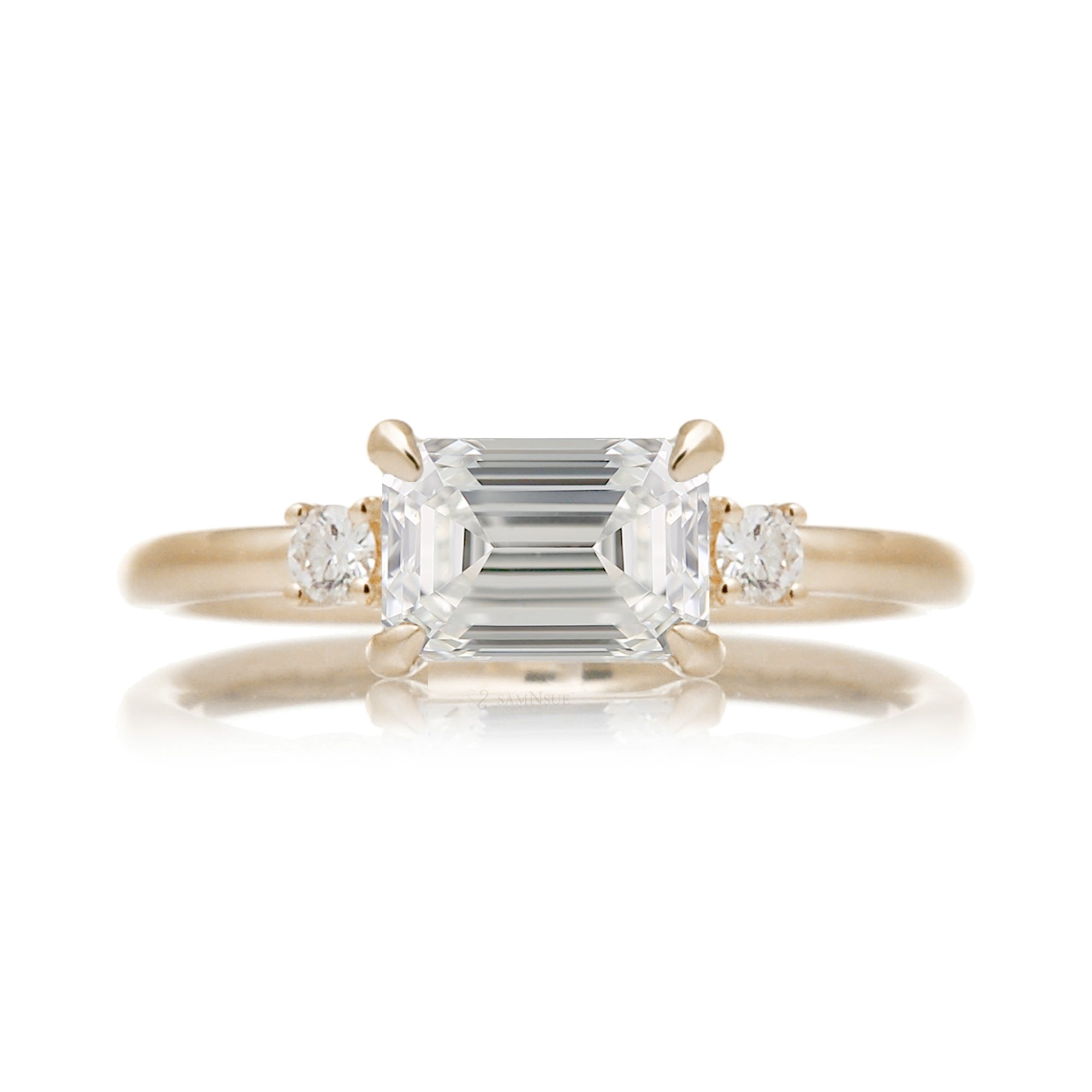 east-west emerald cut diamond three stone ring the Lena yellow gold