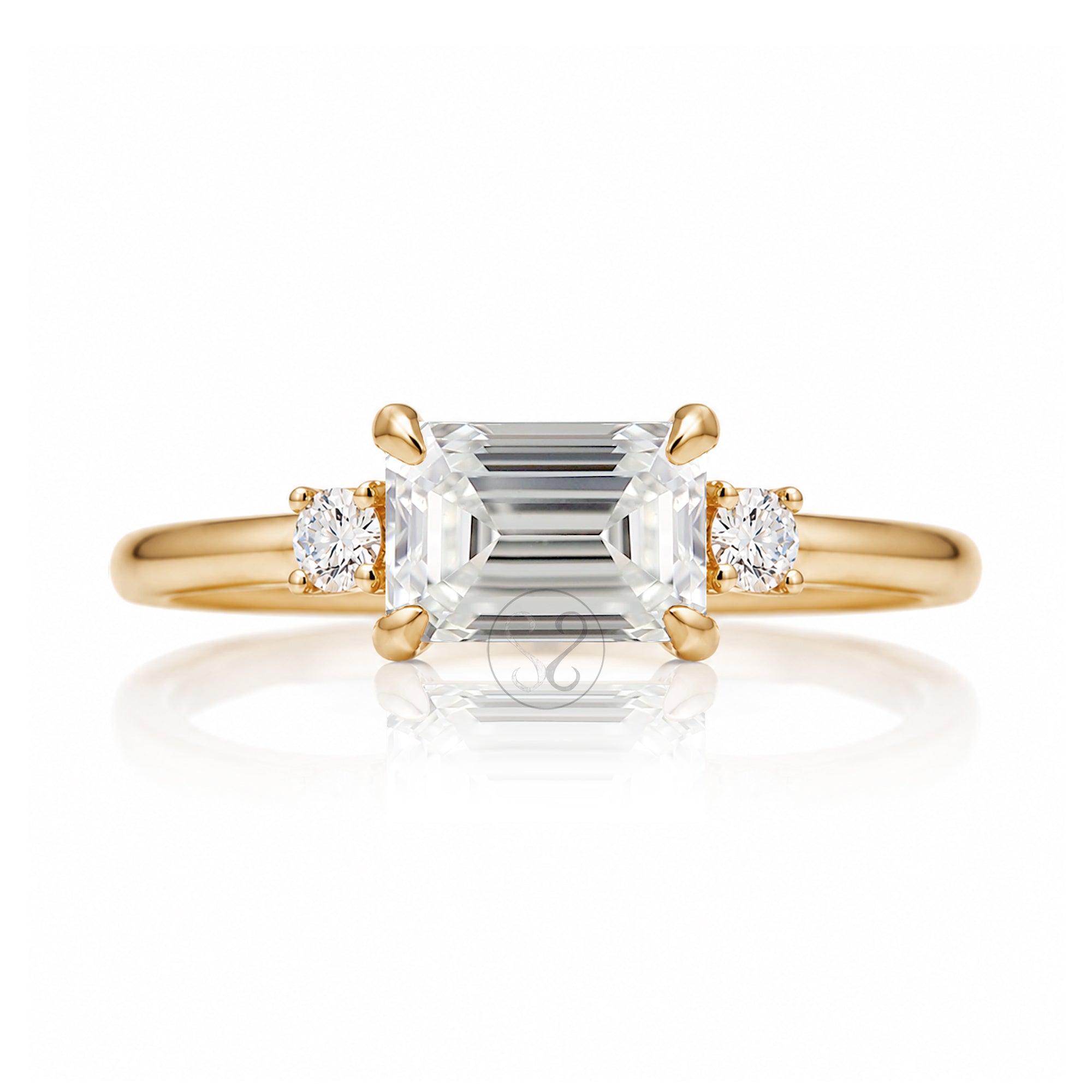 east-west emerald cut diamond three stone ring the Lena yellow gold