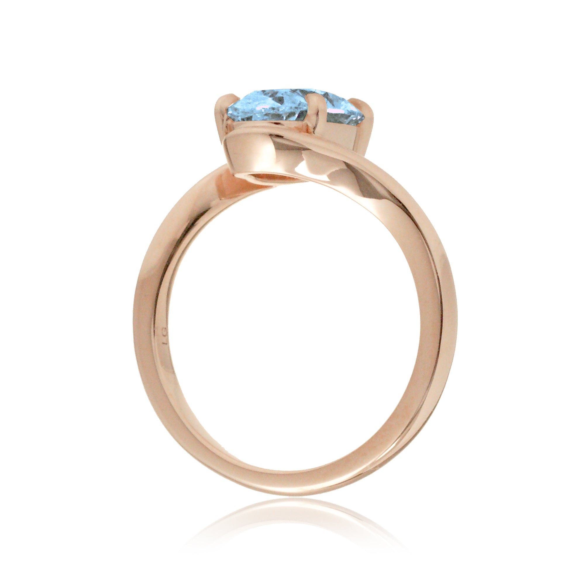Oval cut aquamarine ring embraced wrap around rose gold solitaire