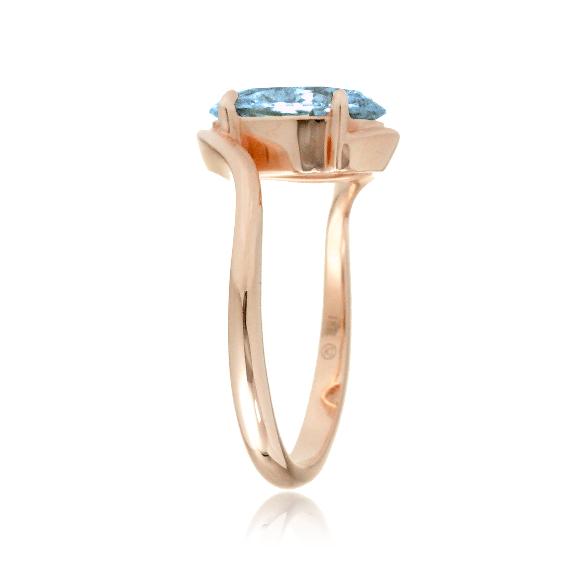 Oval cut aquamarine ring embraced wrap around rose gold solitaire