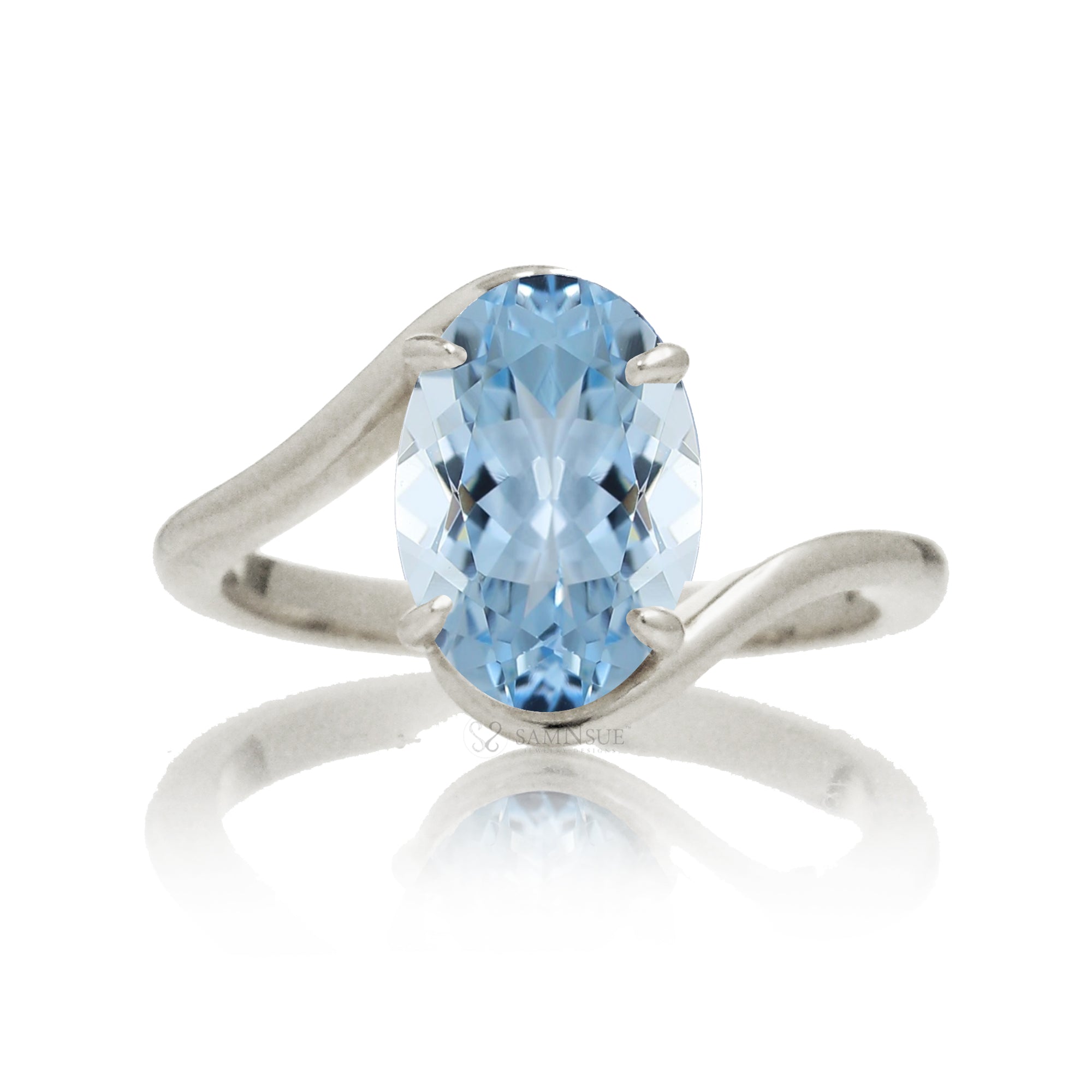 Oval cut aquamarine ring embraced wrap around white gold solitaire