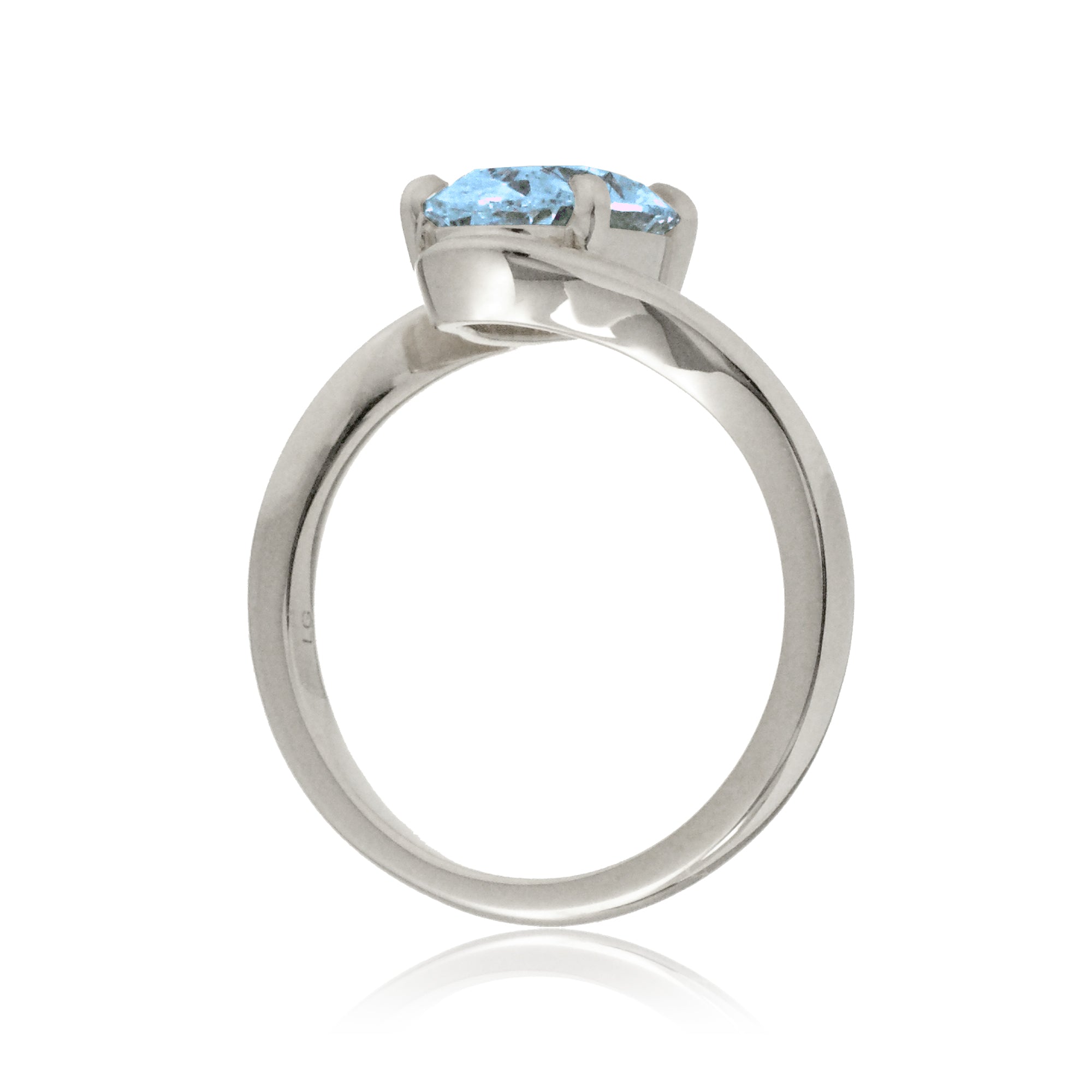 Oval cut aquamarine ring embraced wrap around white gold solitaire