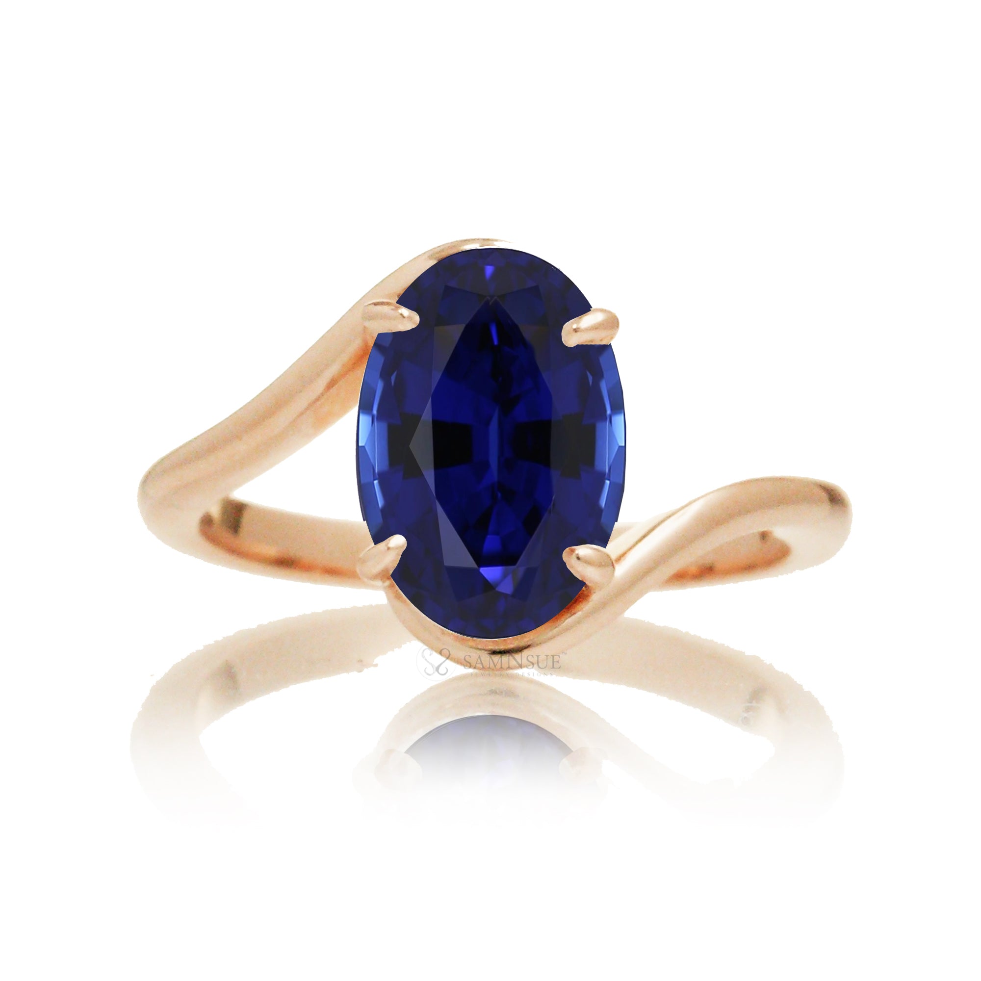 Contemporary oval blue sapphire engagement ring with twisting rose gold band