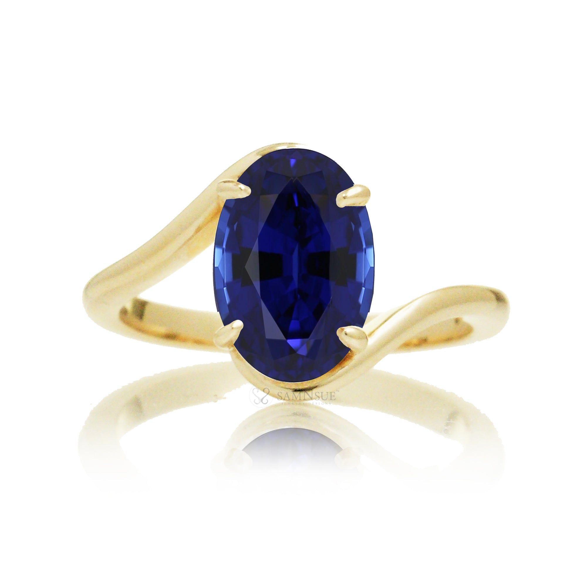 Elegant bypass-style oval sapphire ring with polished yellow gold shank
