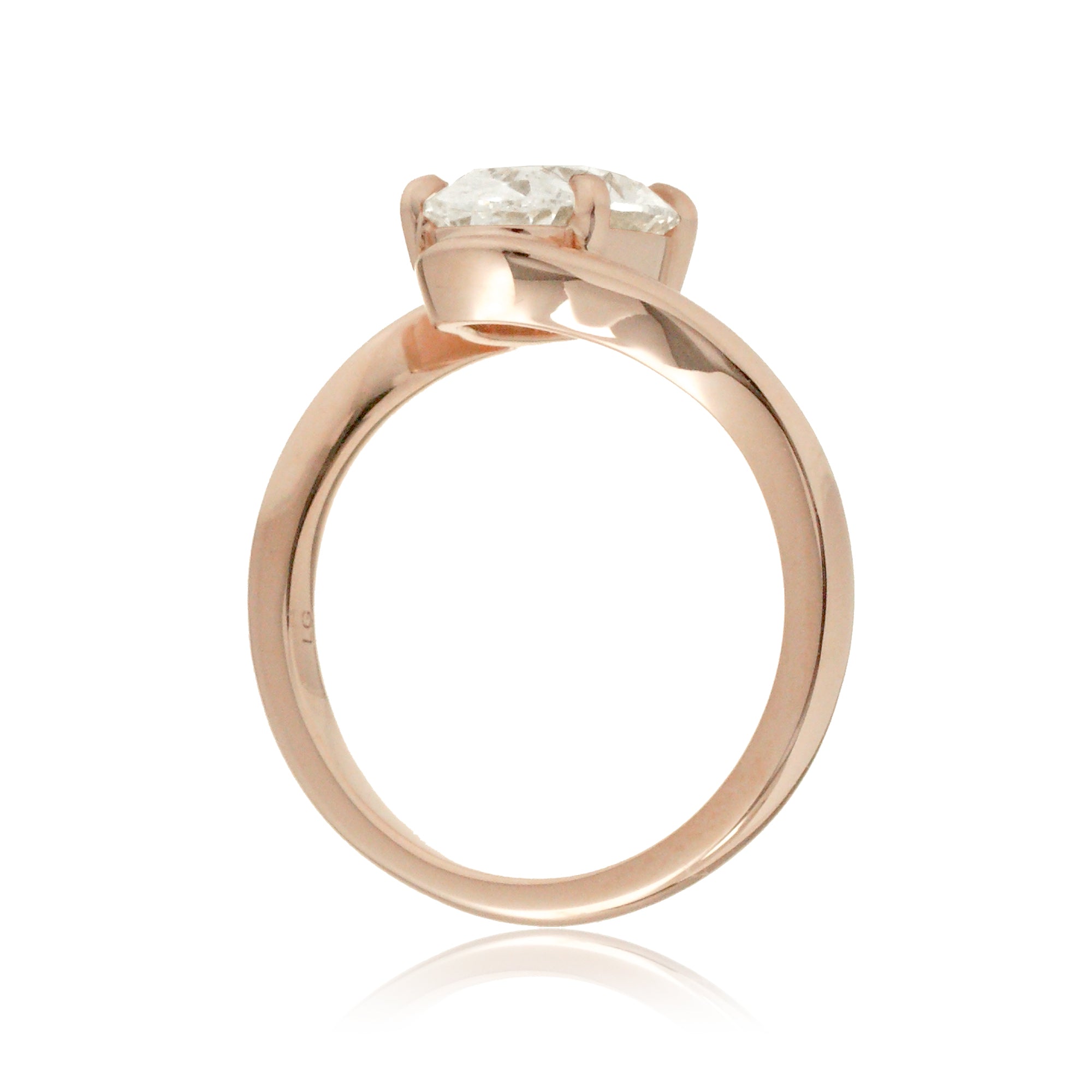 Contemporary oval diamond engagement ring with twisting rose gold band