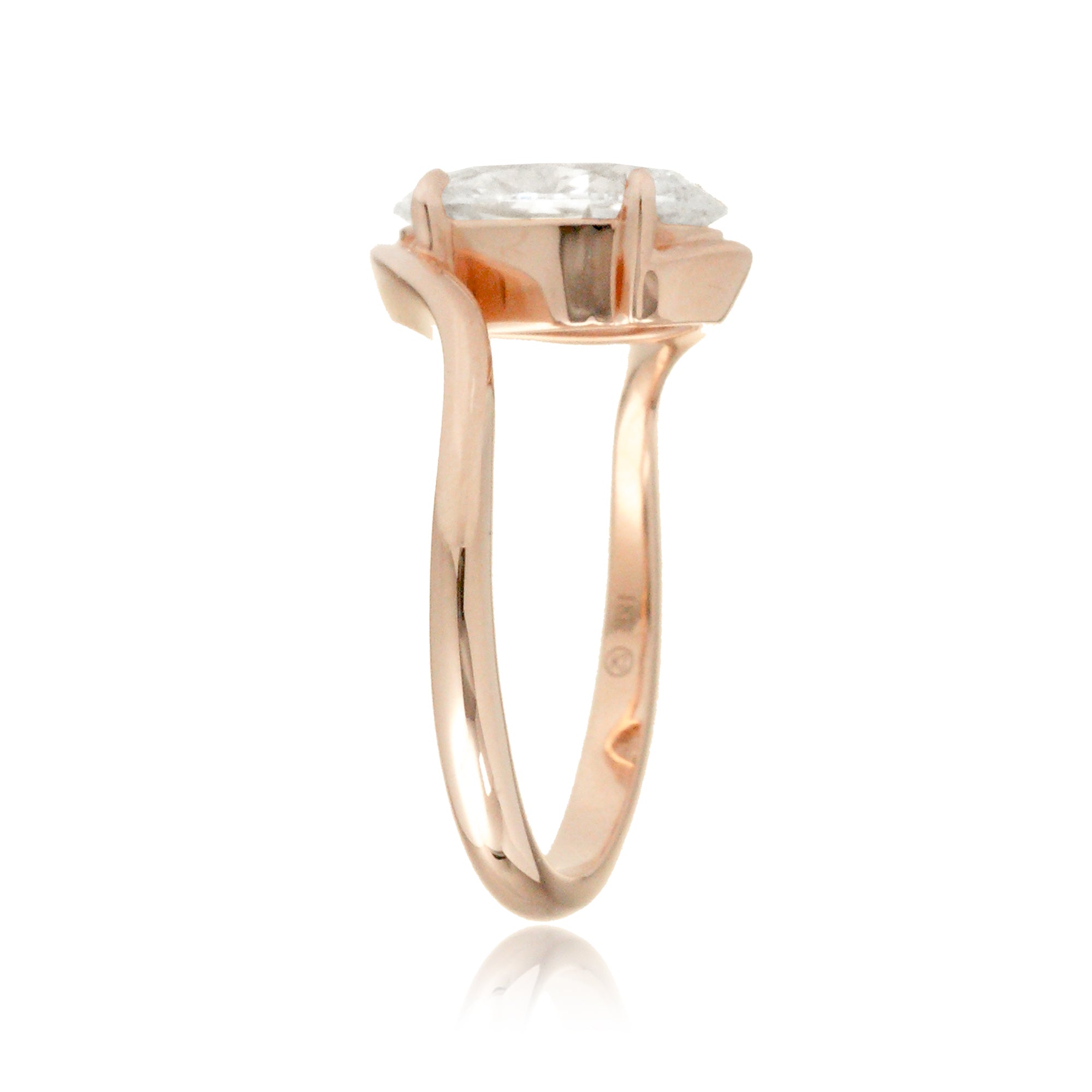 Contemporary oval diamond engagement ring with twisting rose gold band