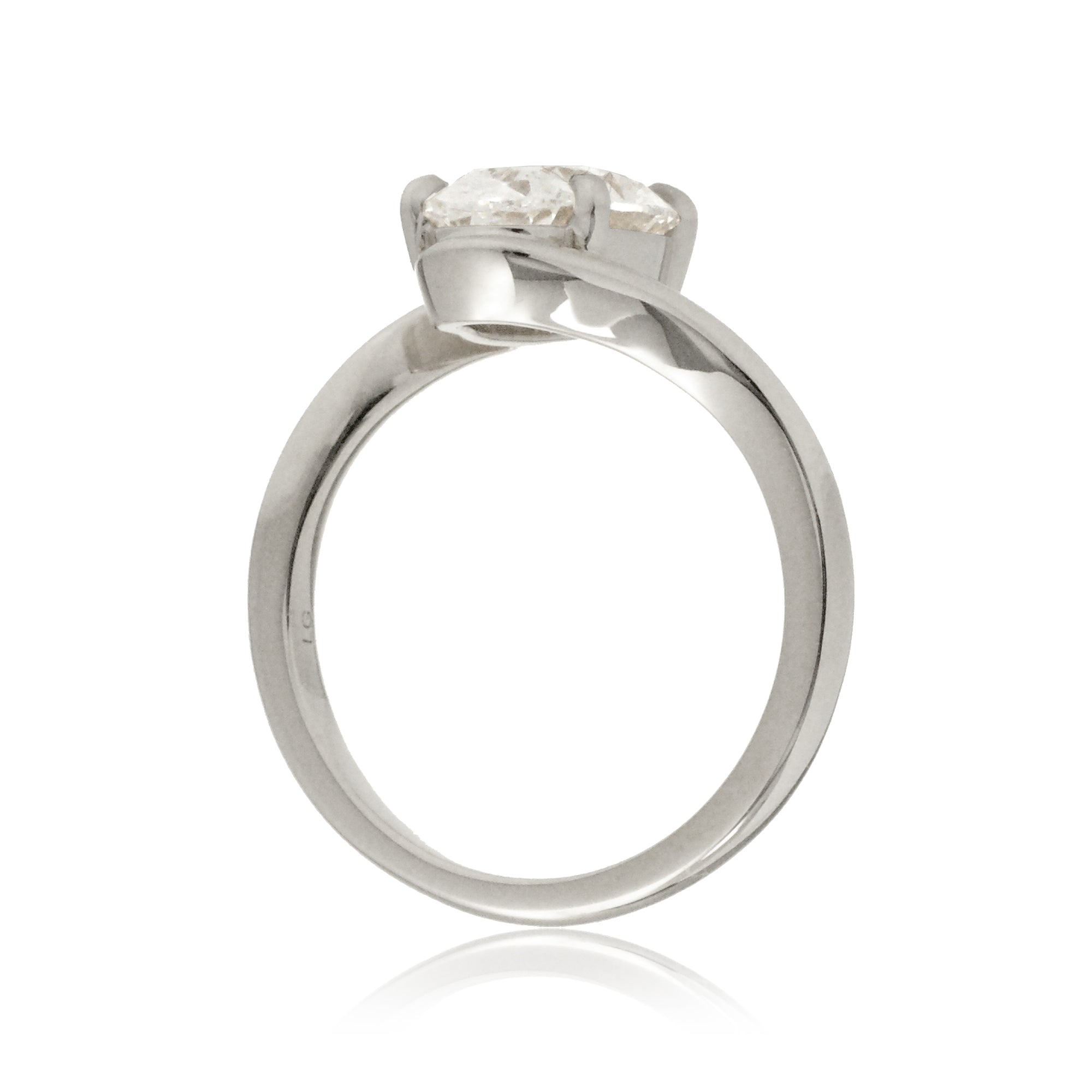 Oval diamond solitaire ring in a modern bypass setting with white gold band