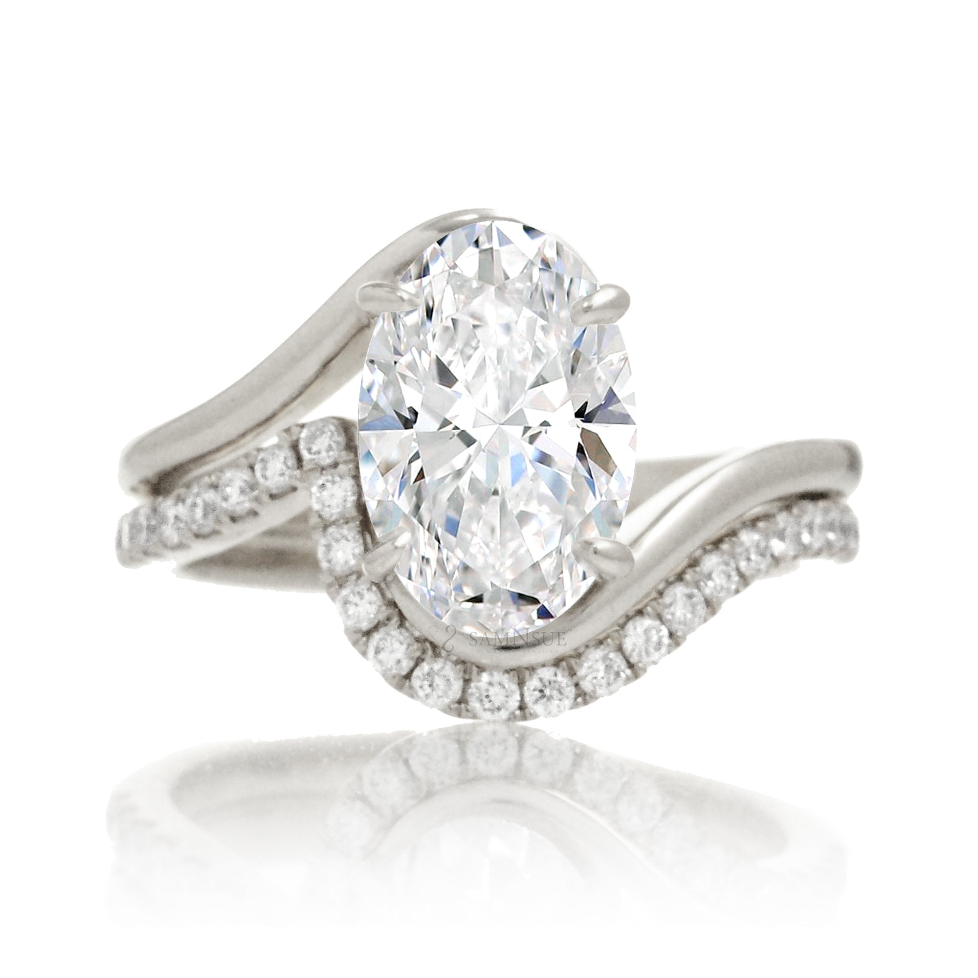 Oval diamond solitaire ring in a modern bypass setting with white gold band