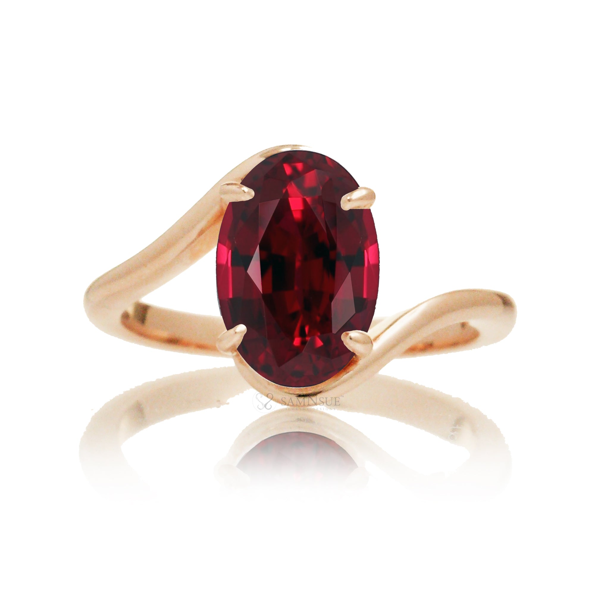 Modern bypass-style ring with deep red oval ruby and rose gold setting