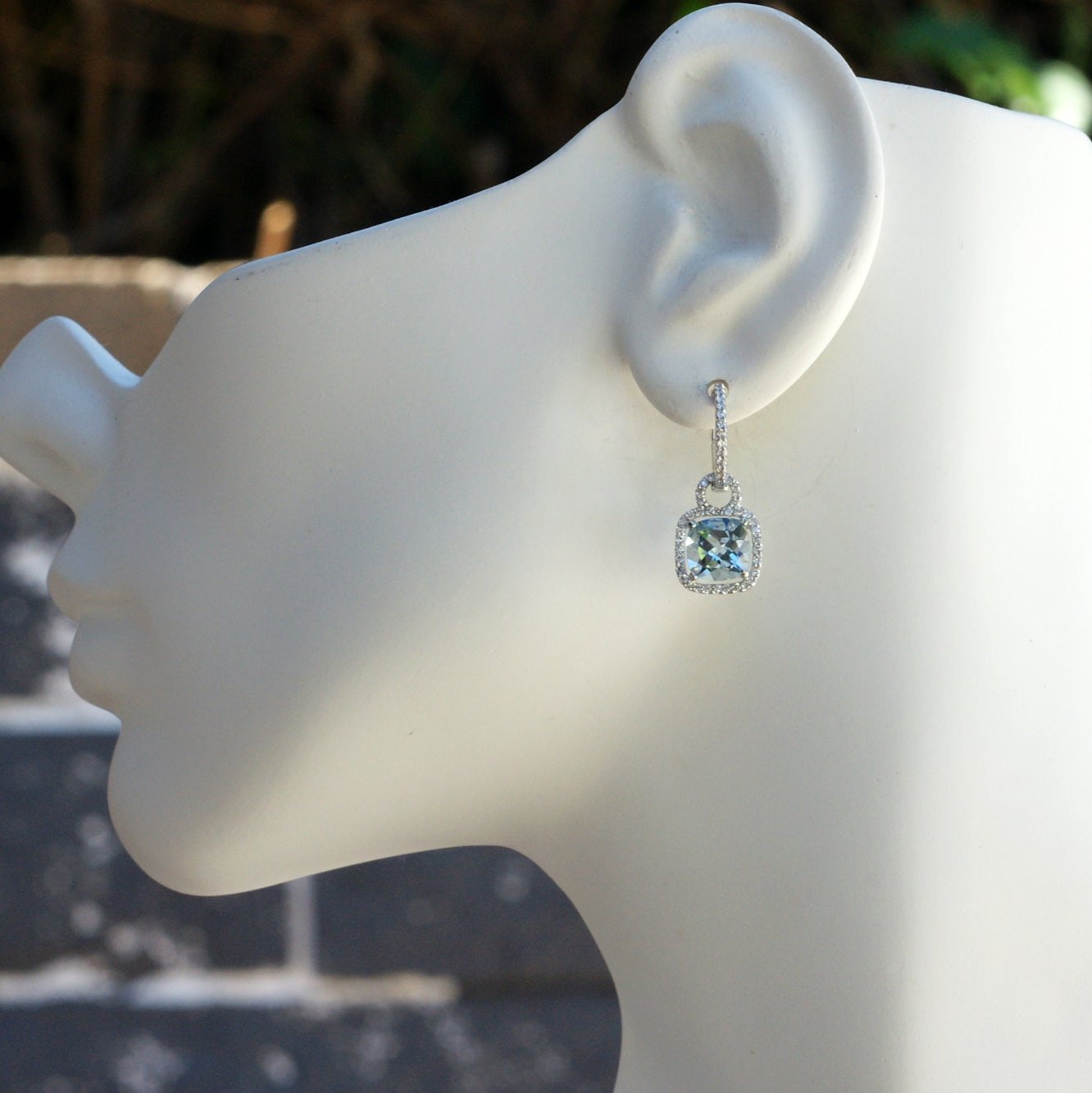 Cushion cut aquamarine dangles and diamond halo hoop earrings in white gold