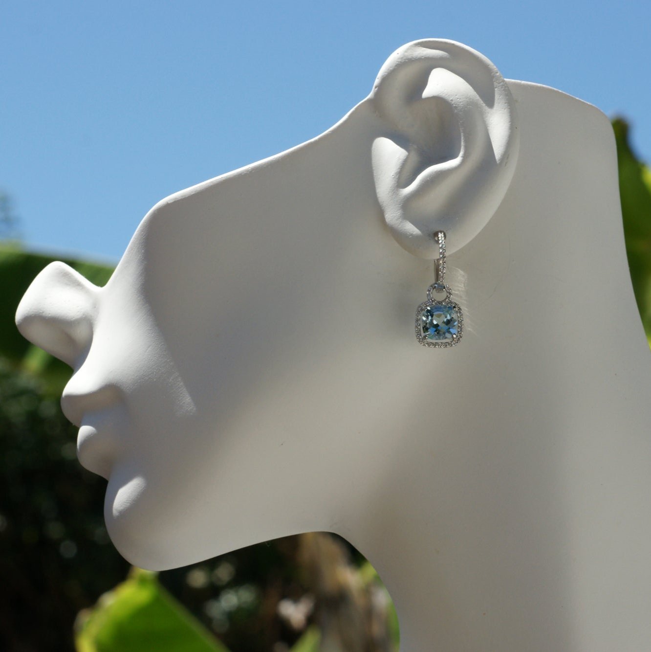 Cushion cut aquamarine dangles and diamond halo hoop earrings in white gold