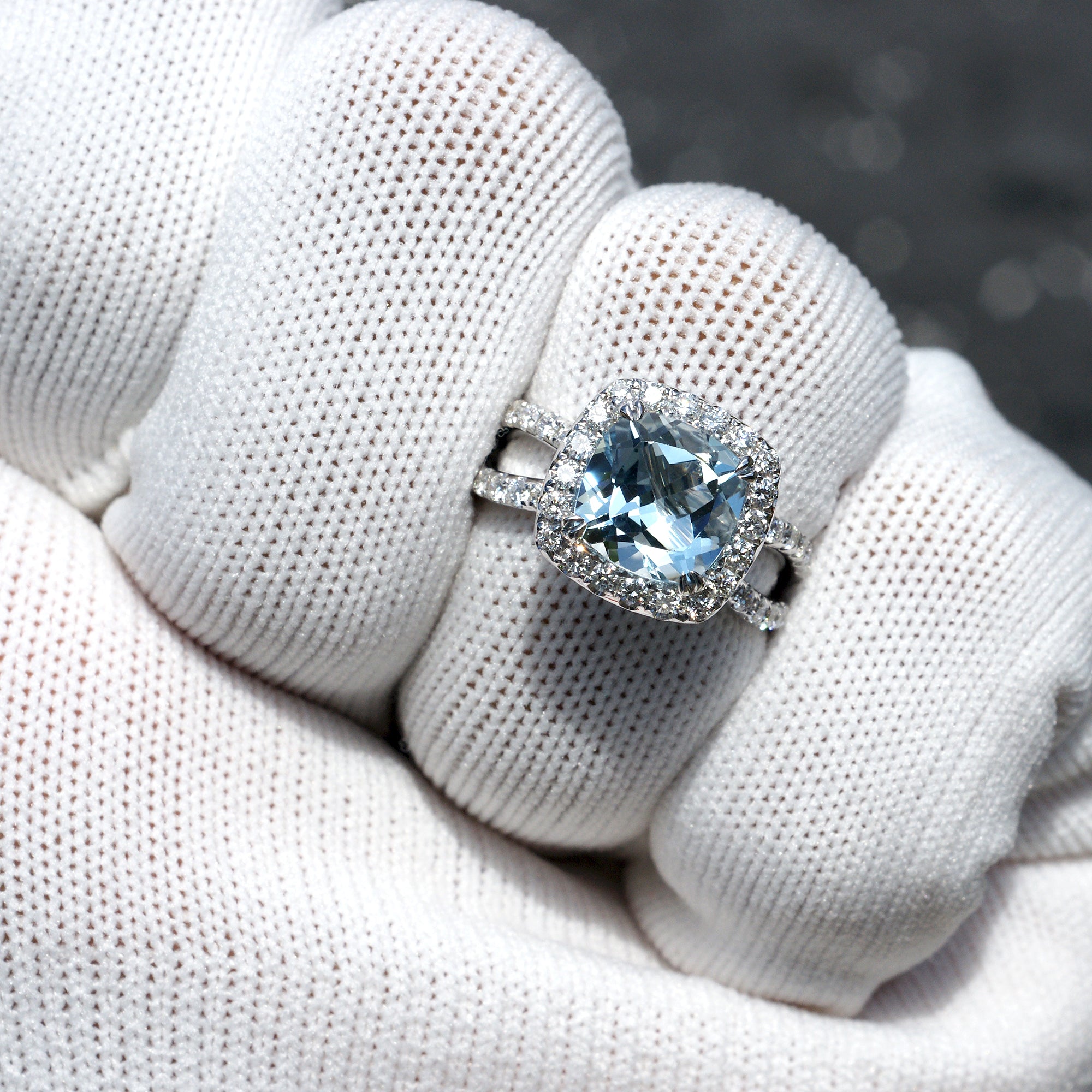 Natural aquamarine and diamond engagement anniversary ring in 18k white gold with a halo and splitband