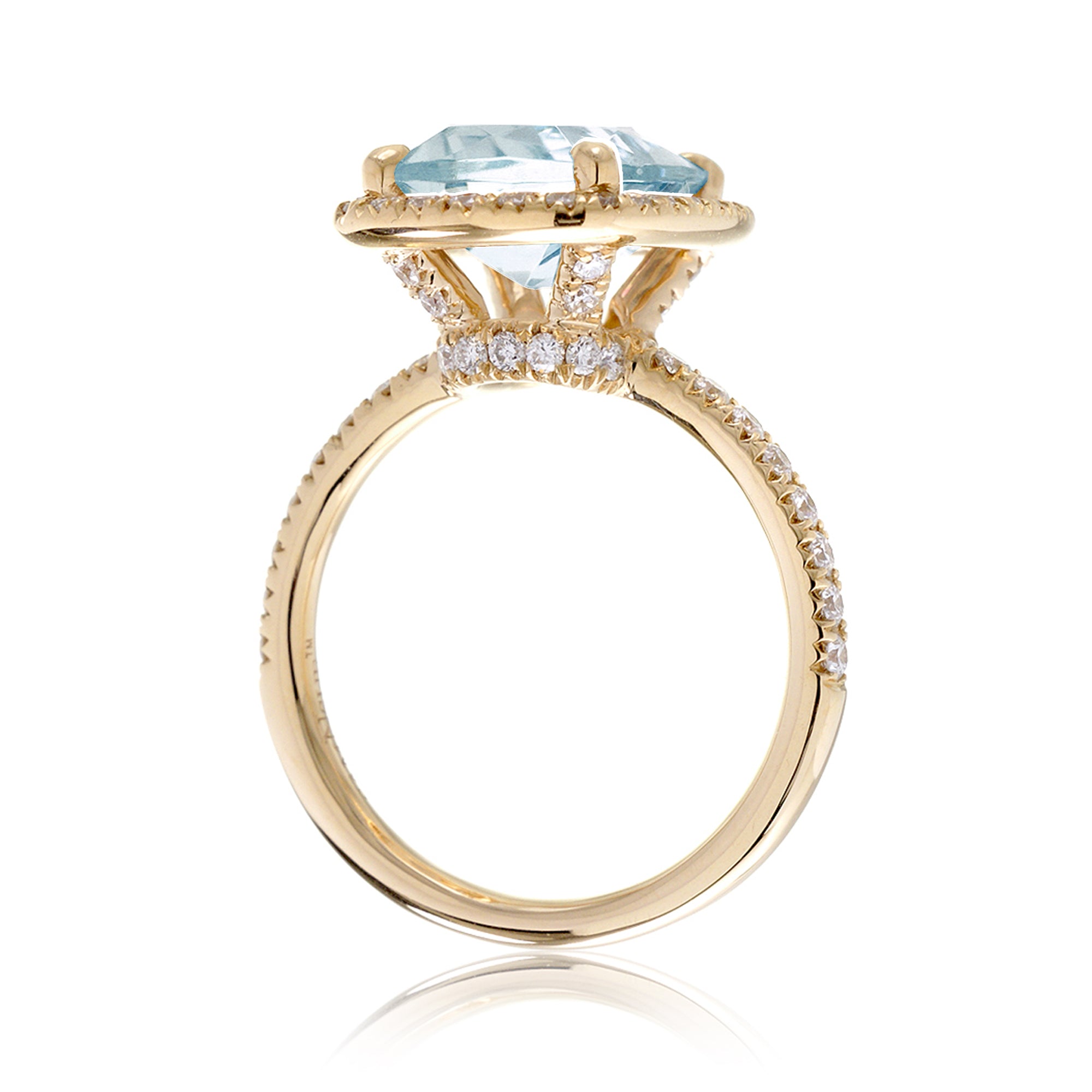 Cushion cut aquamarine ring with a diamond halo and comfort fit band the Drenched yellow gold side view