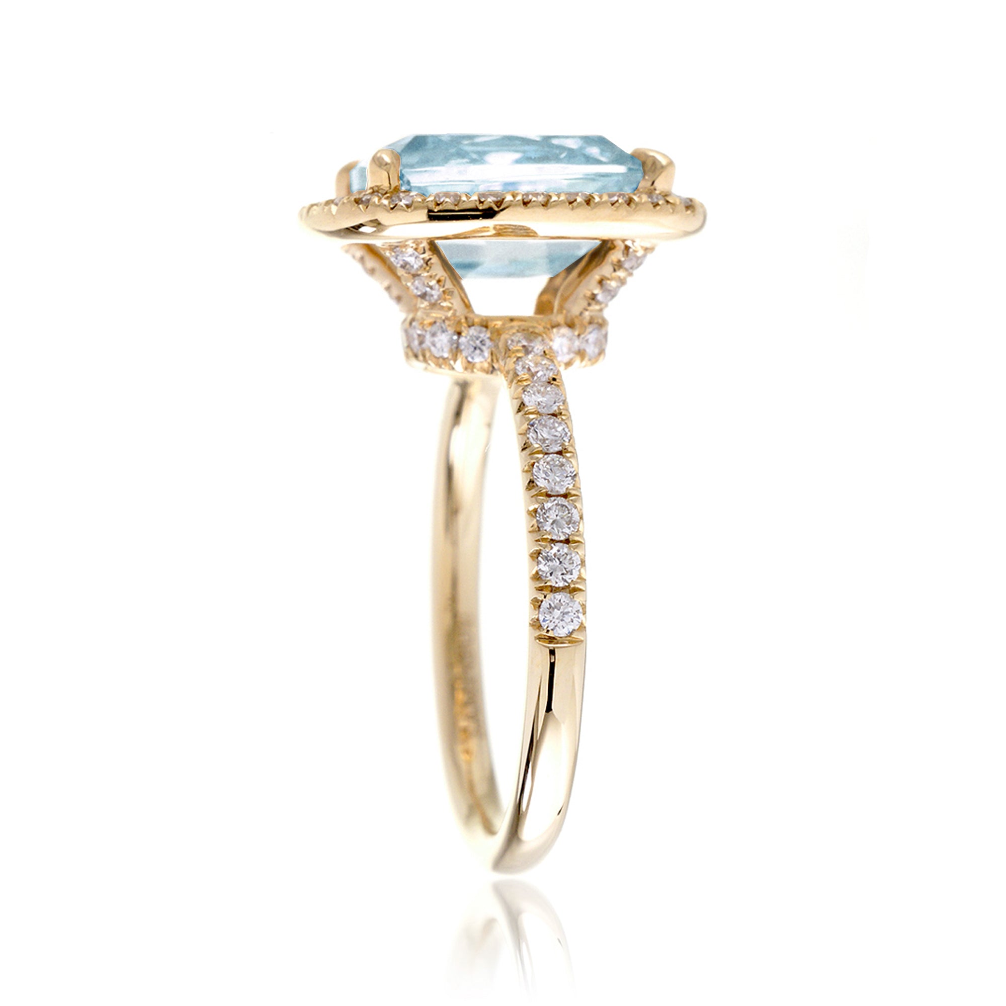 Cushion cut aquamarine ring with a diamond halo and comfort fit band the Drenched yellow gold side profile