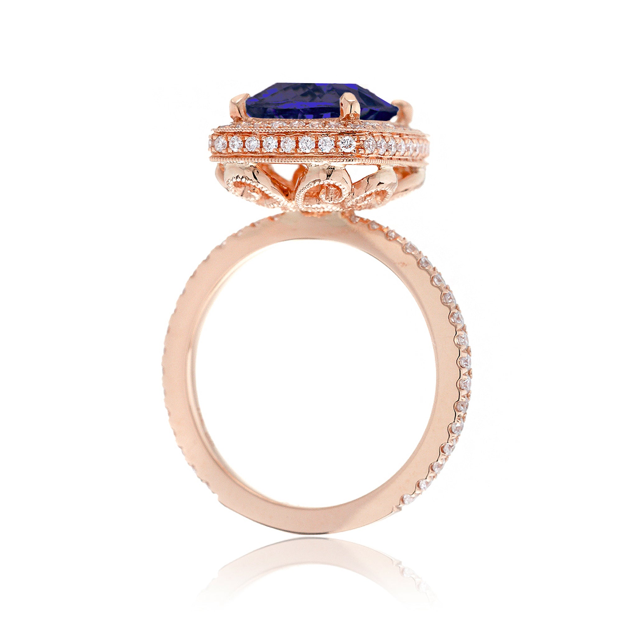 Cushion sapphire engagement ring with vintage scrolls and diamond accent rose gold