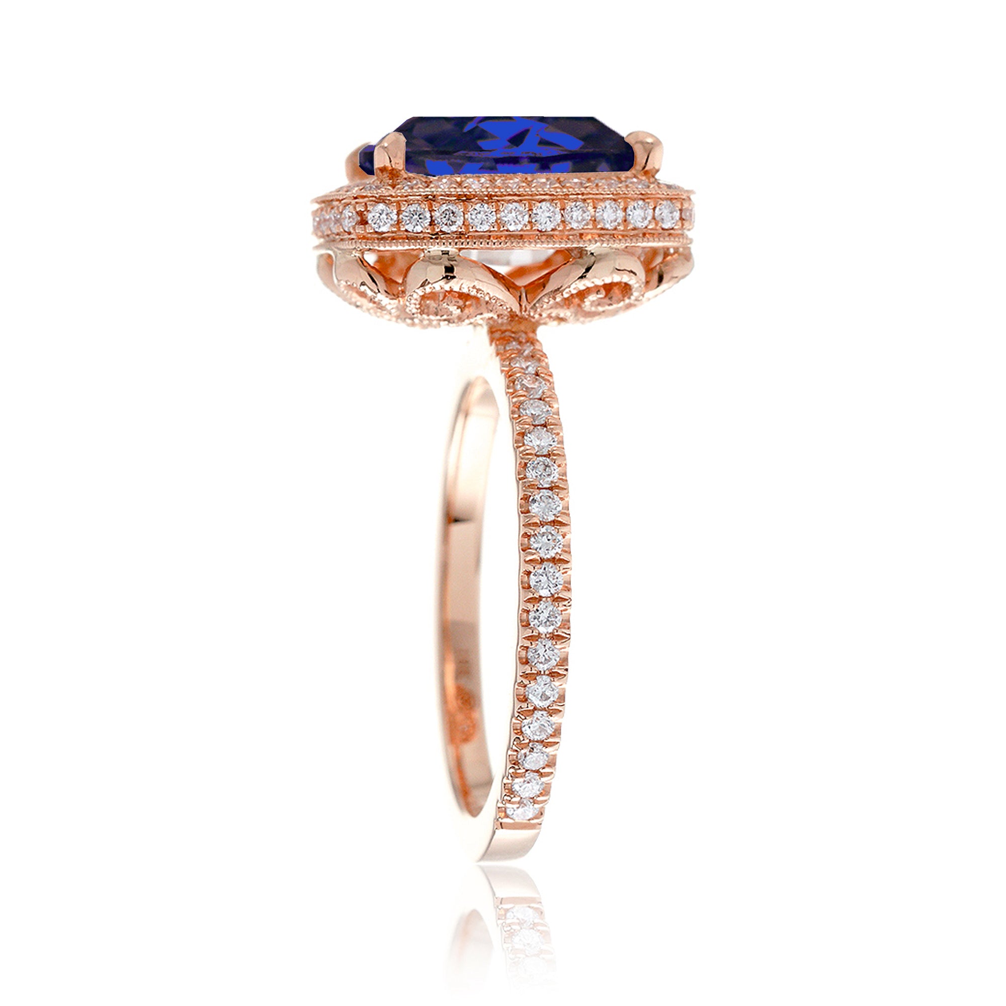 Cushion sapphire engagement ring with vintage scrolls and diamond accent rose gold