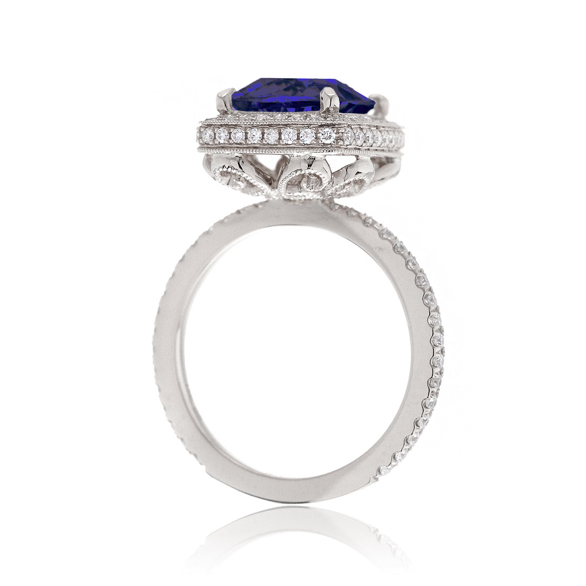 Cushion sapphire engagement ring with vintage scrolls and diamond accent white gold