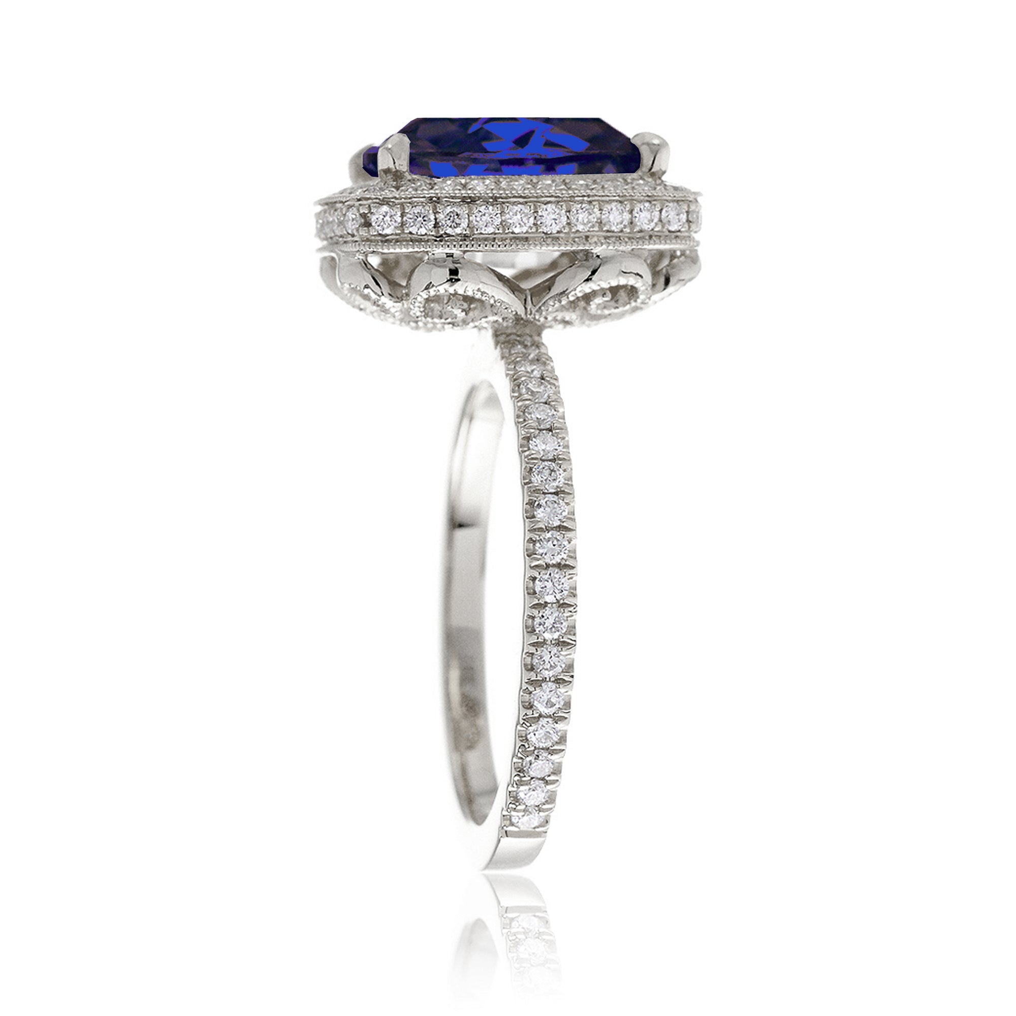 Cushion sapphire engagement ring with vintage scrolls and diamond accent white gold