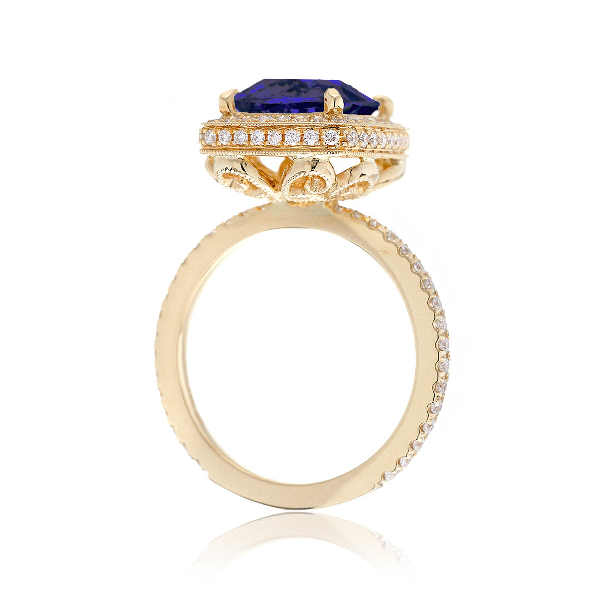 Cushion sapphire engagement ring with vintage scrolls and diamond accent yellow gold