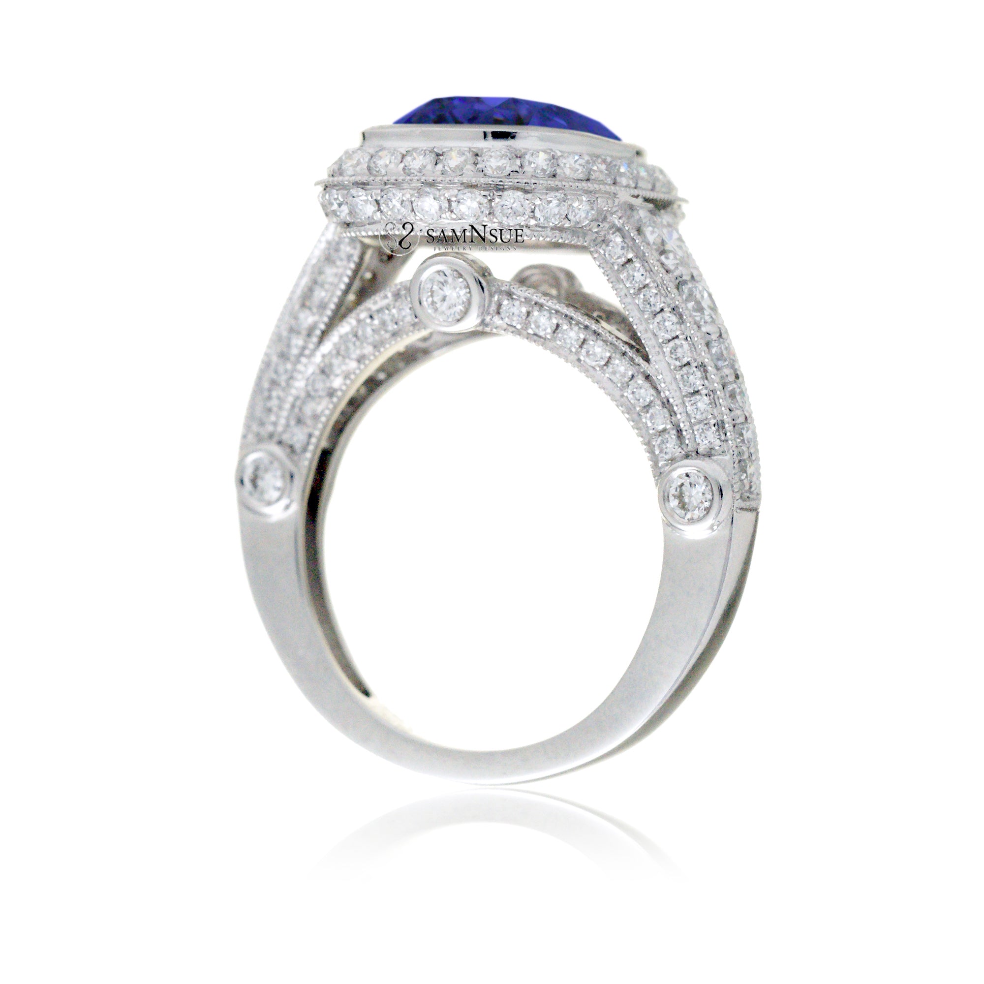 Cushion cut bezel blue sapphire diamond halo ring