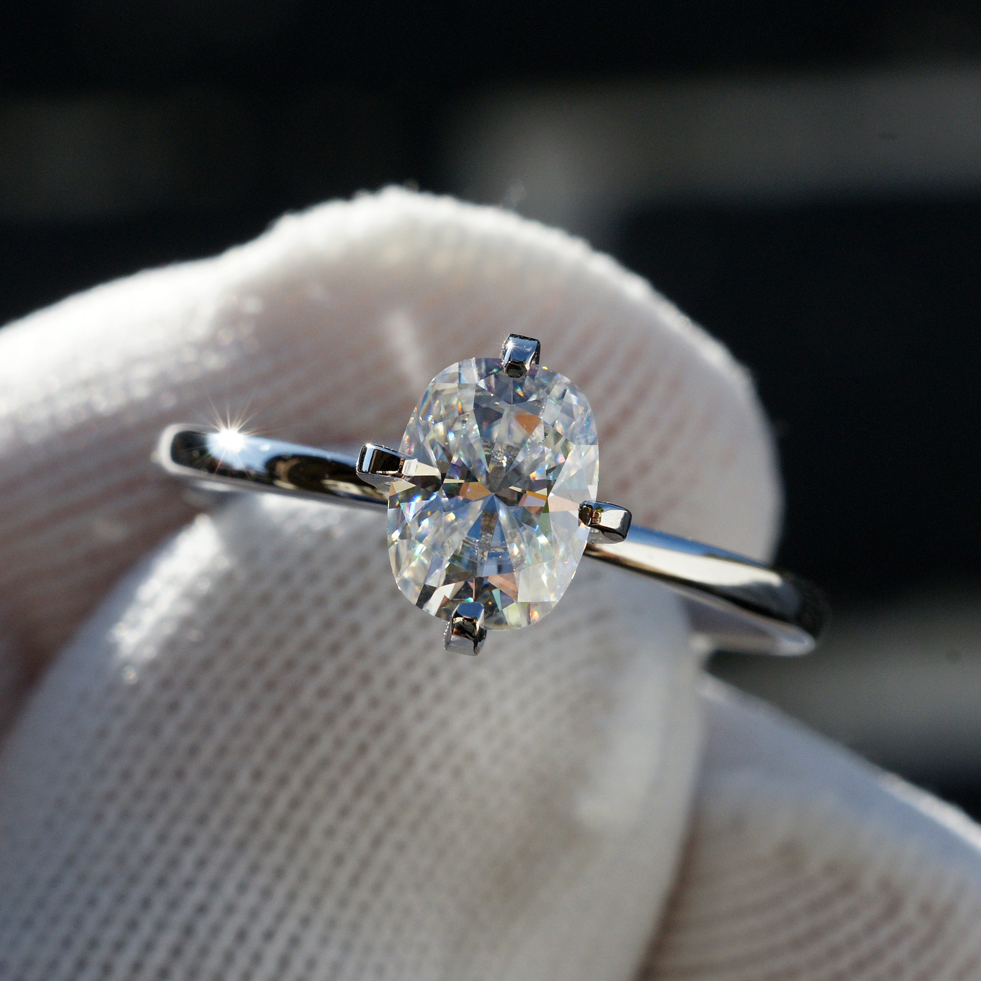 The Adeline Cushion Moissanite 8x6mm 18k white gold middle prongs