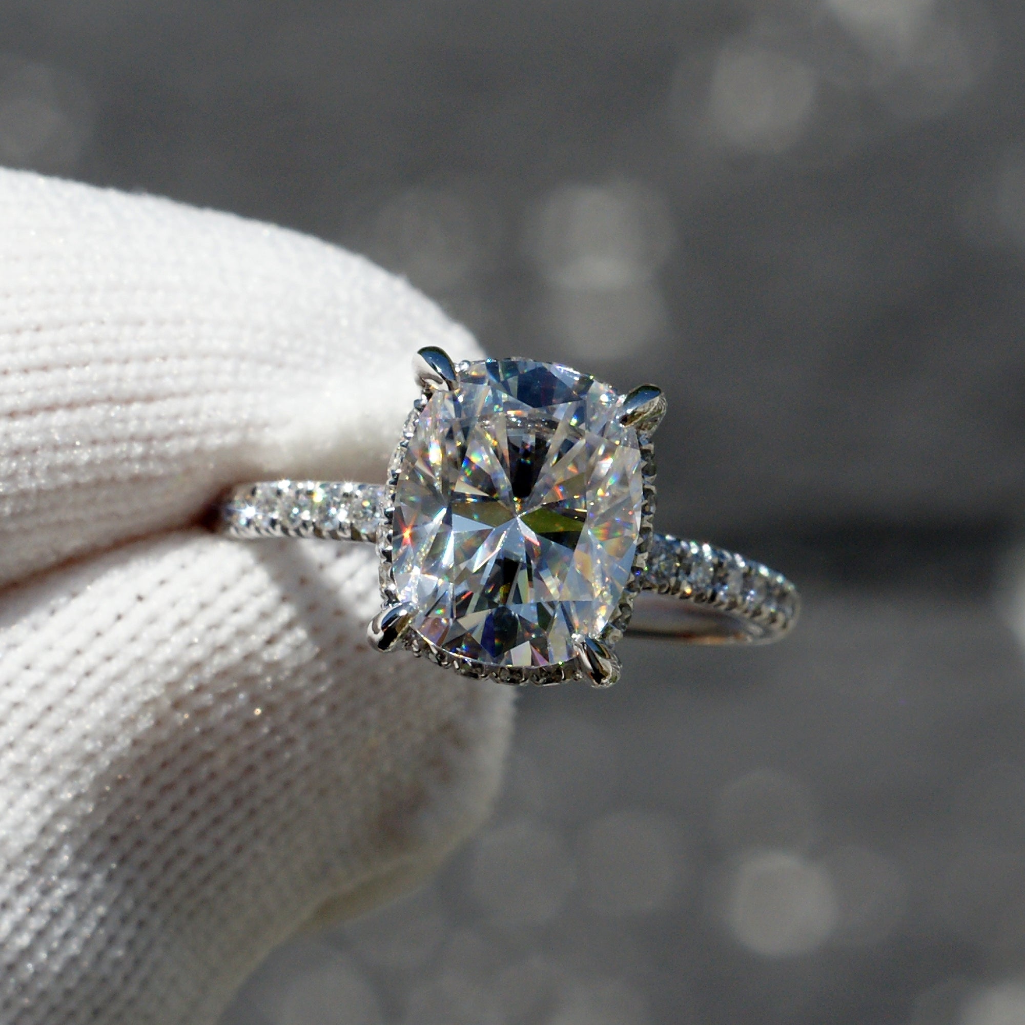 The Drenched Solitaire Cushion Moissanite Ring 10x8 Platinum