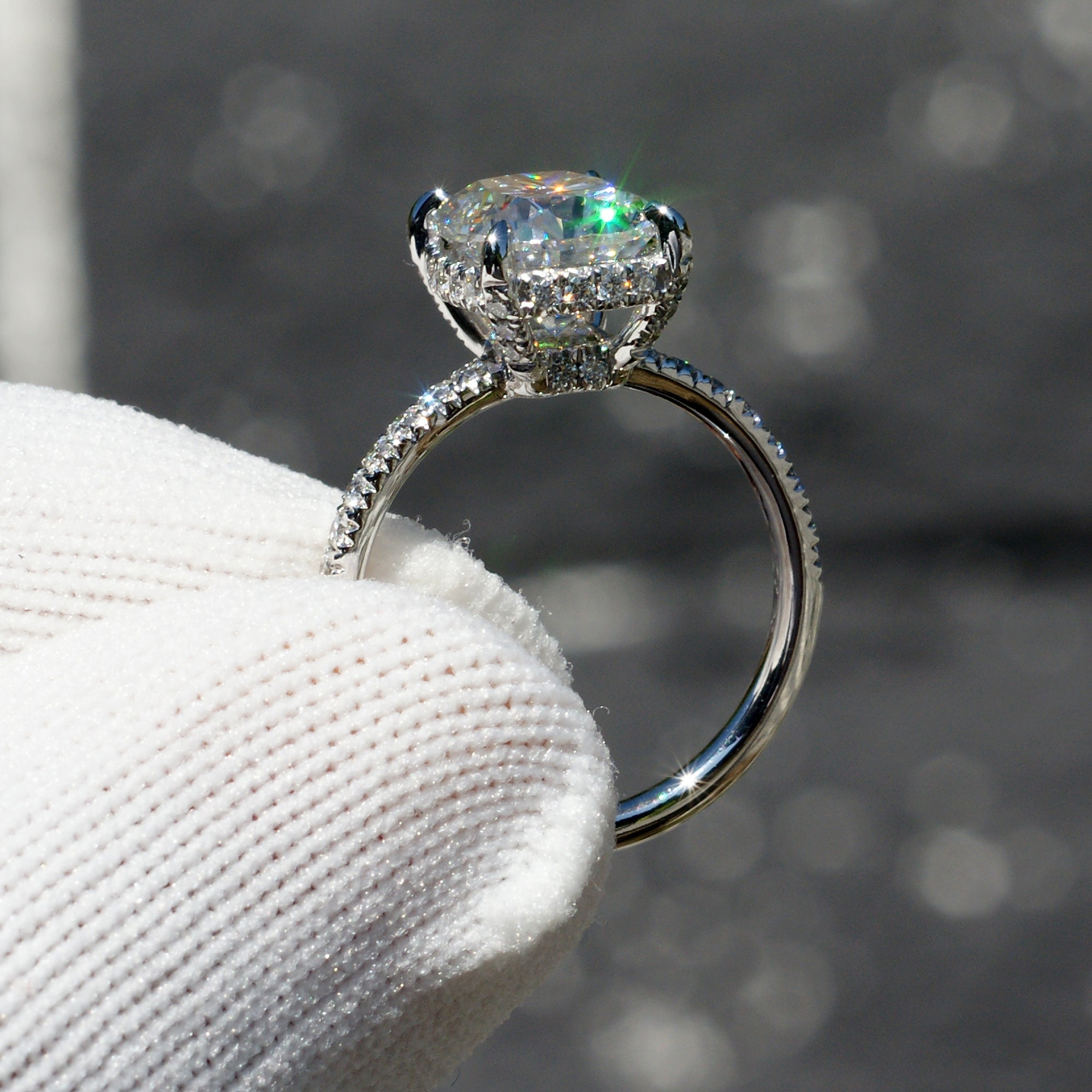 The Drenched Solitaire Cushion Moissanite Ring 10x8 Platinum