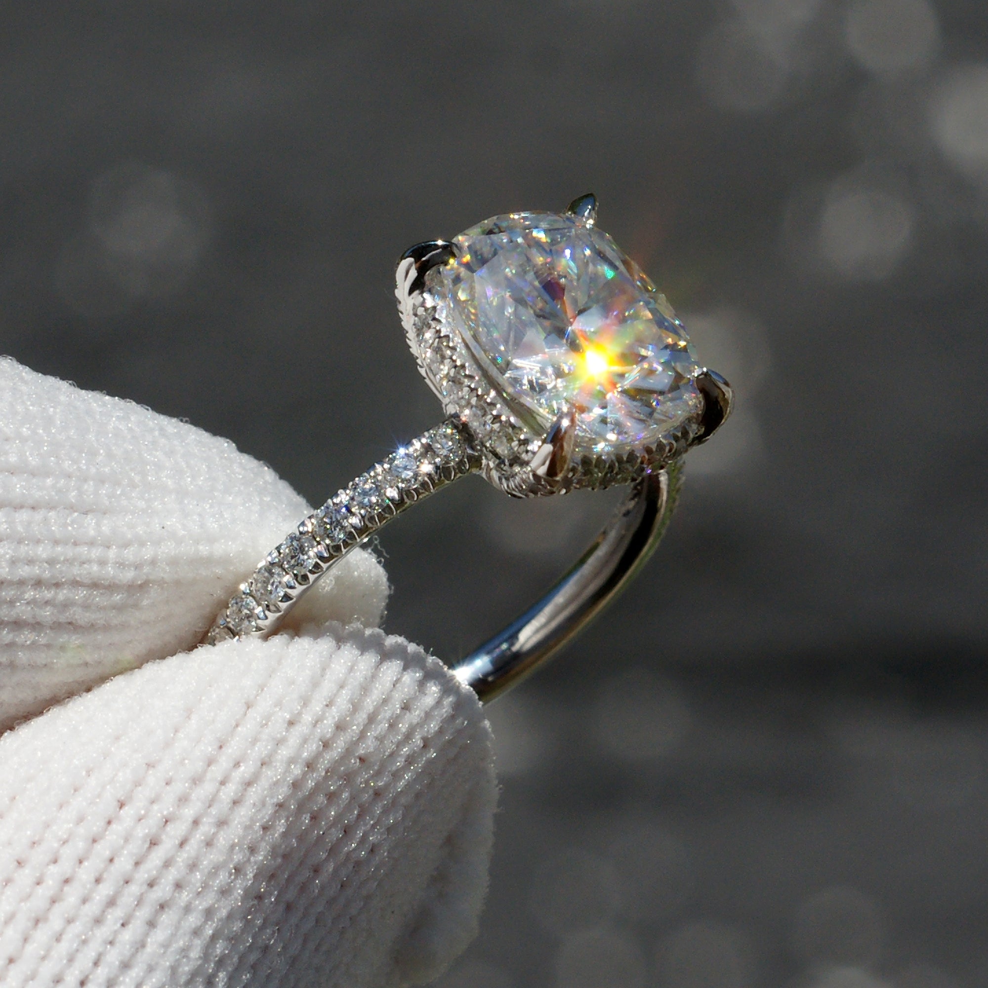 The Drenched Solitaire Cushion Moissanite Ring 10x8 Platinum