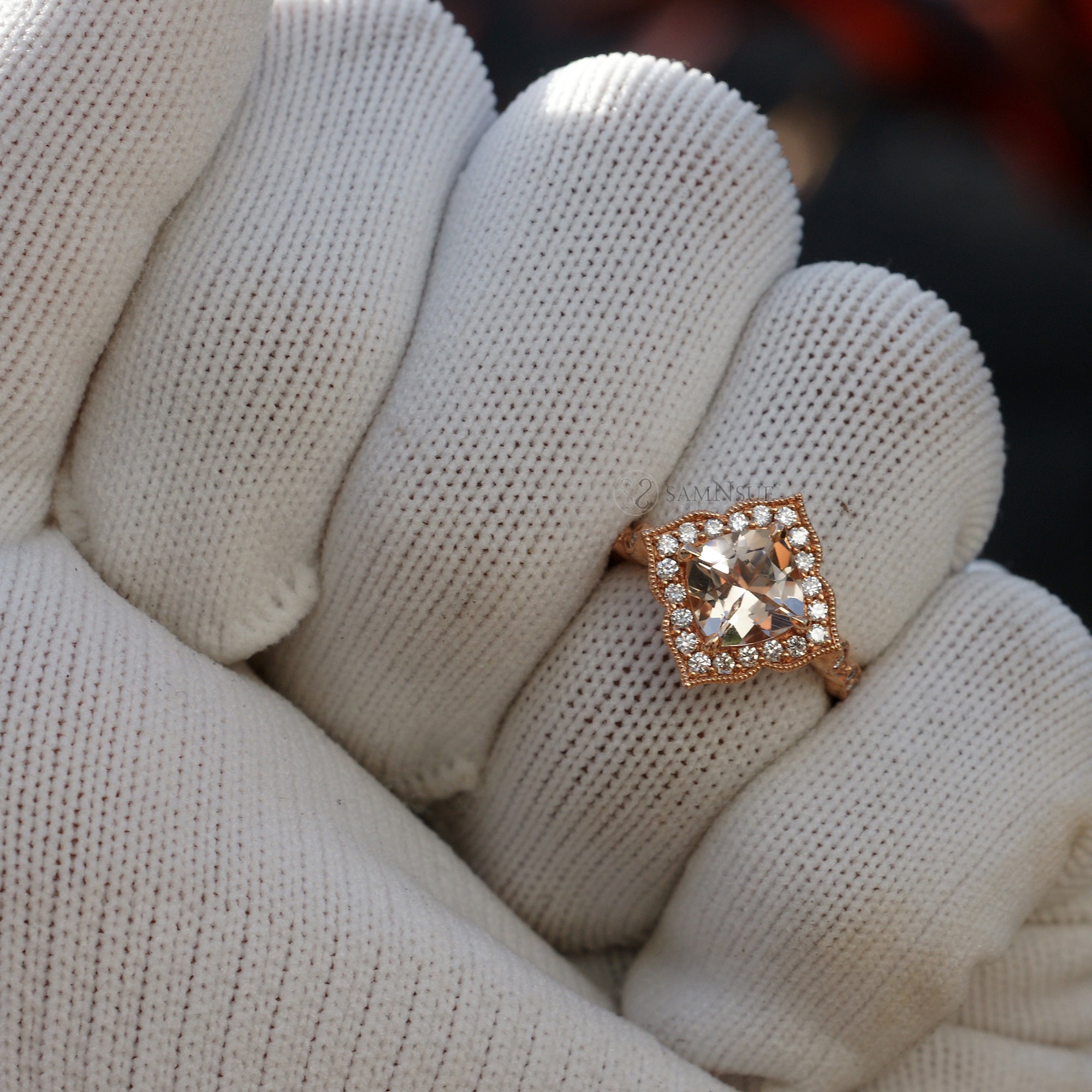 Cushion morganite ring in rose gold with a diamond halo