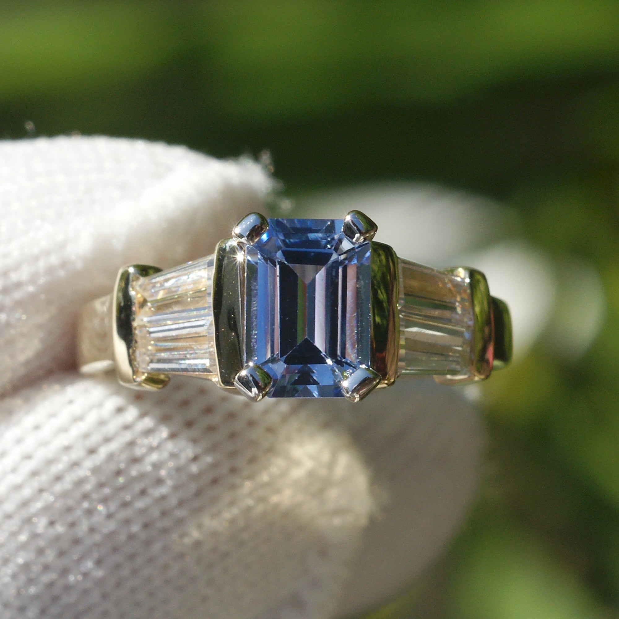 Natural sapphire and diamond baguette three stone ring in yellow gold