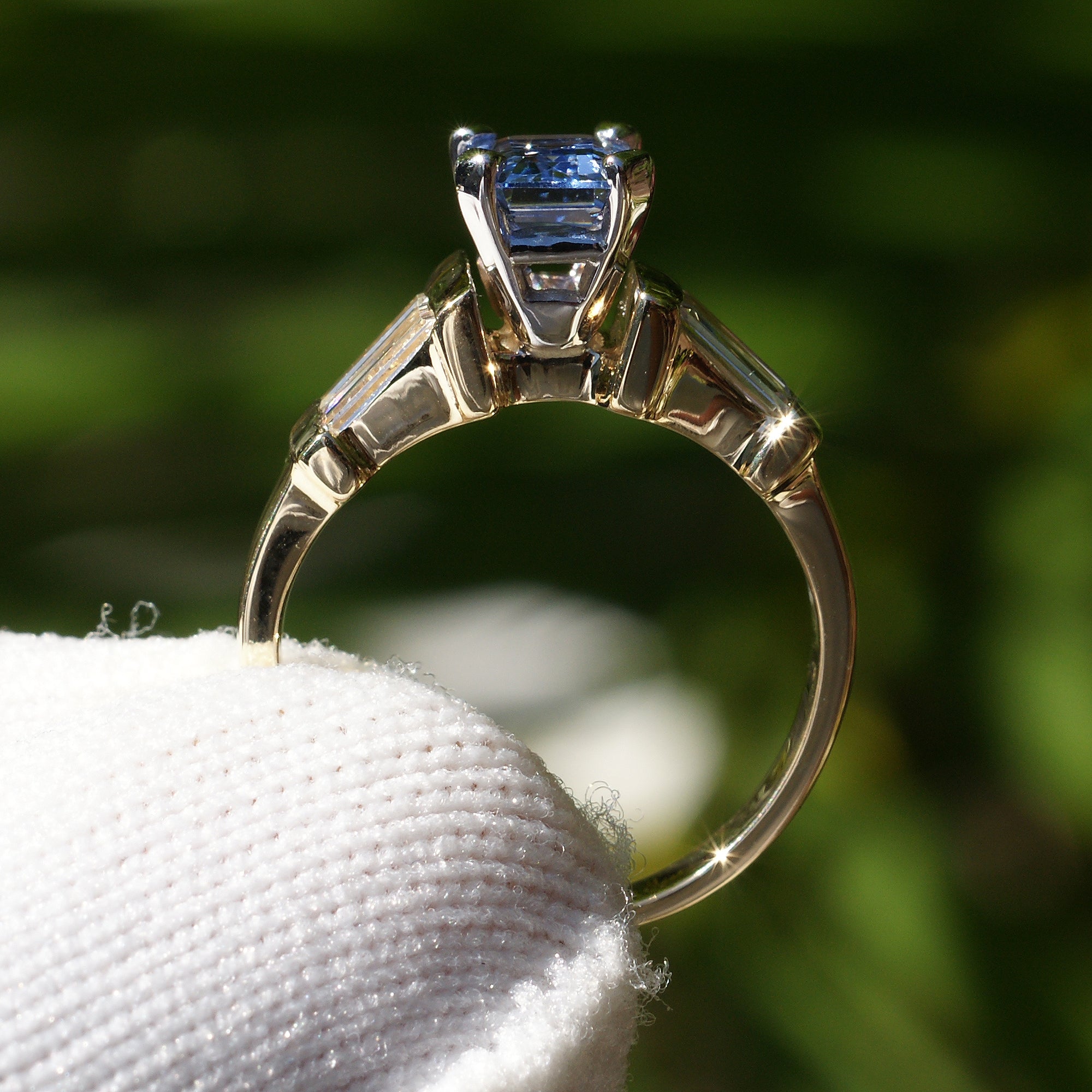 Natural sapphire and diamond baguette three stone ring in yellow gold