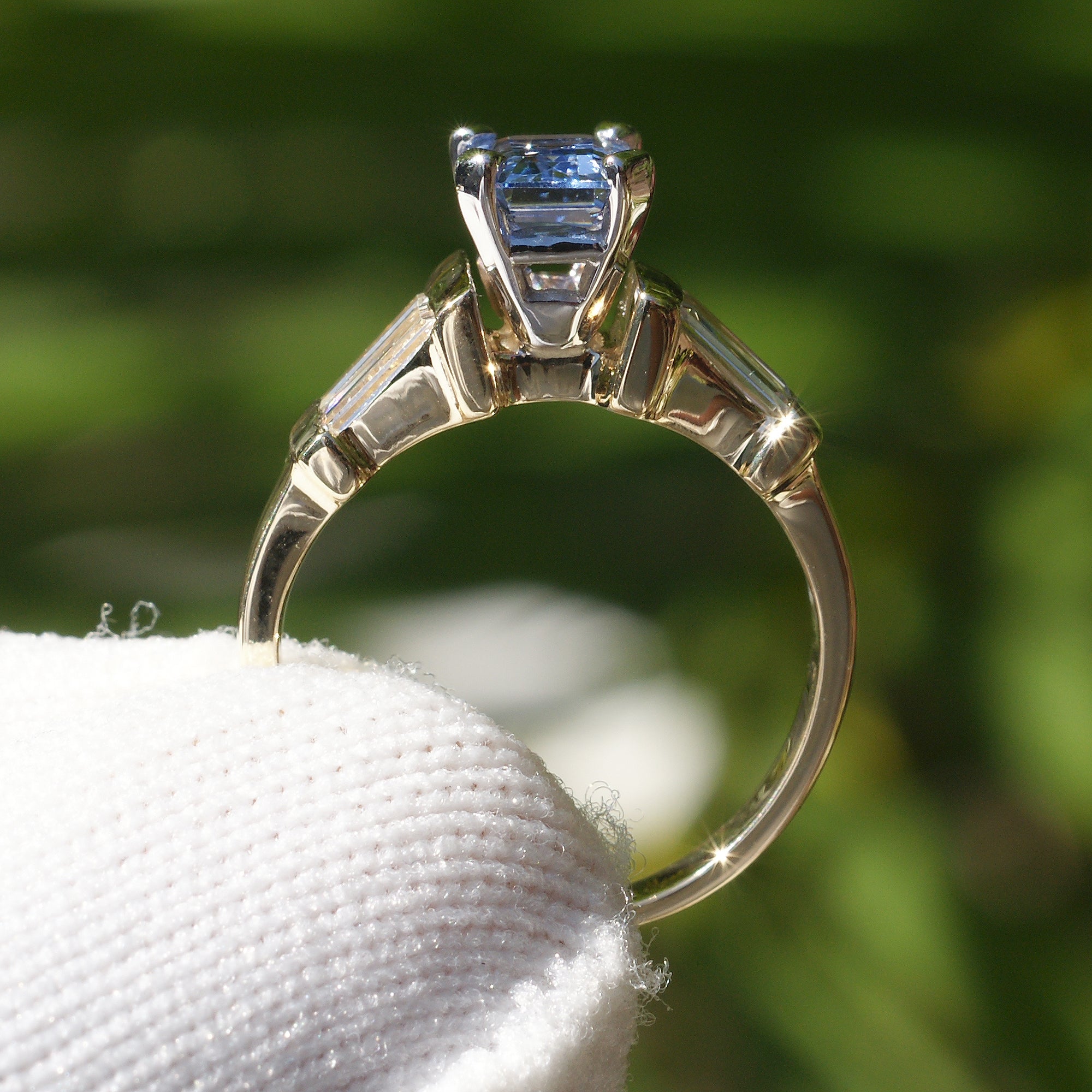 Natural sapphire and diamond baguette three stone ring in yellow gold