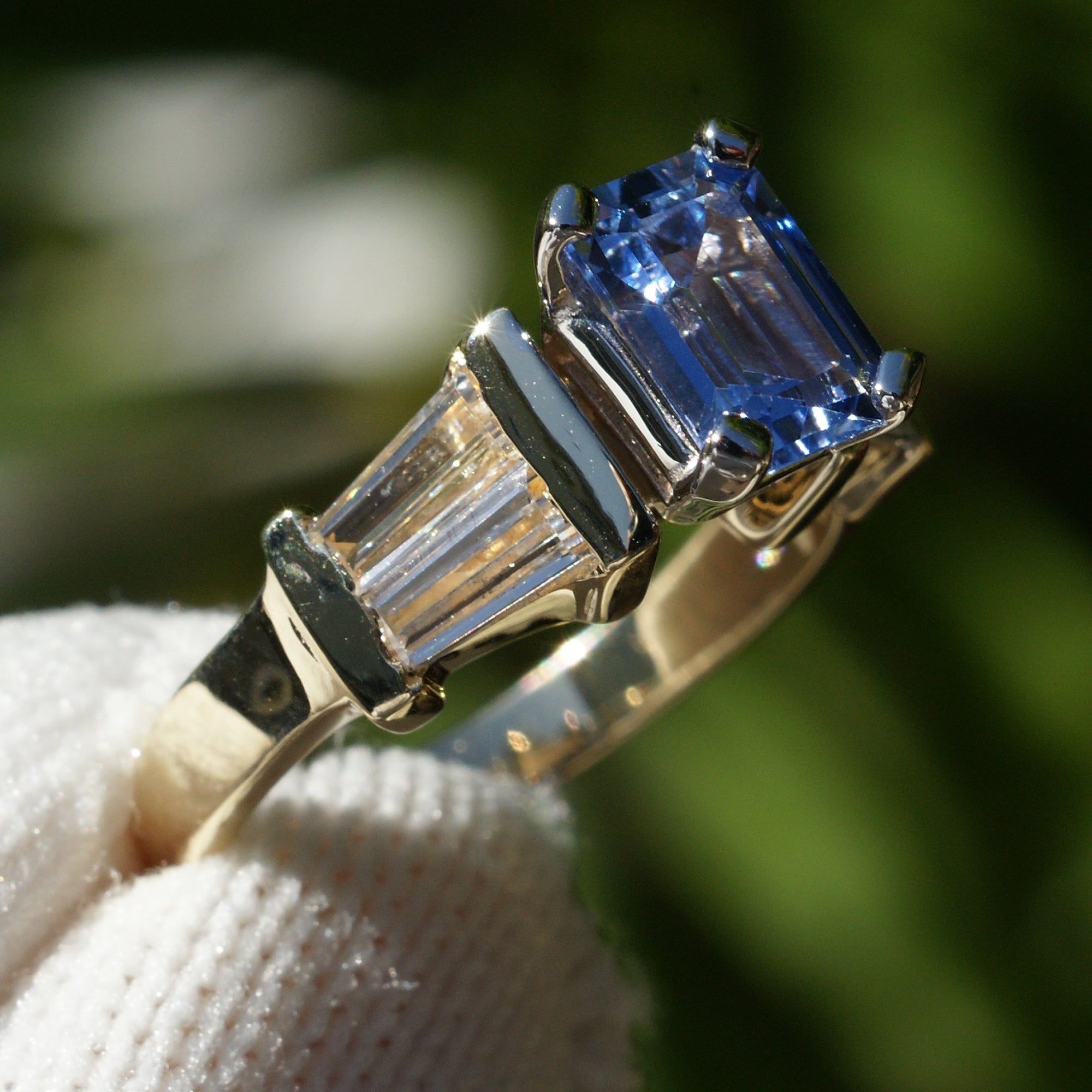Natural sapphire and diamond baguette three stone ring in yellow gold