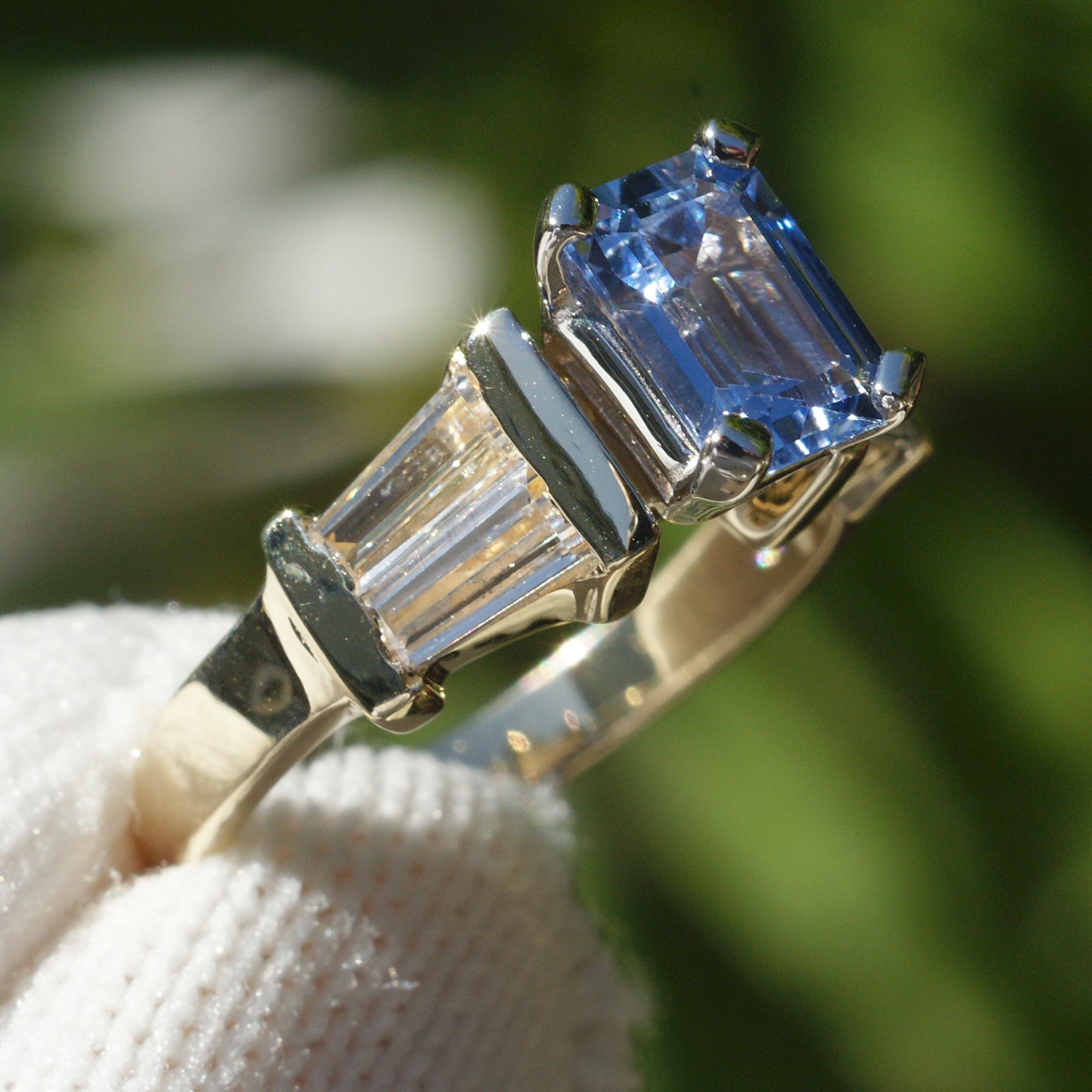 Natural sapphire and diamond baguette three stone ring in yellow gold